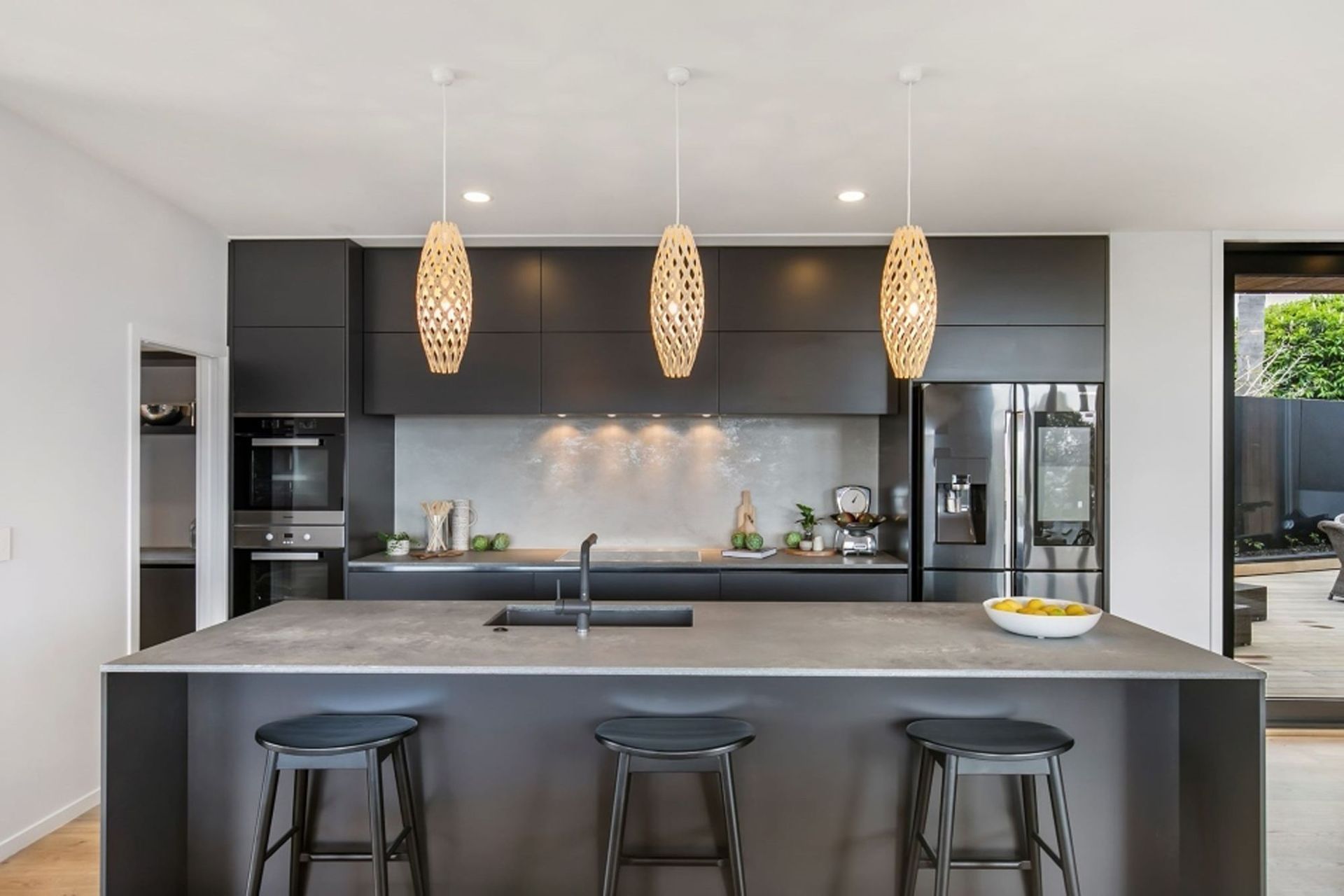 The traditional 'black and white' colour scheme has been given a modern twist in the kitchen, which also features a butler's pantry.