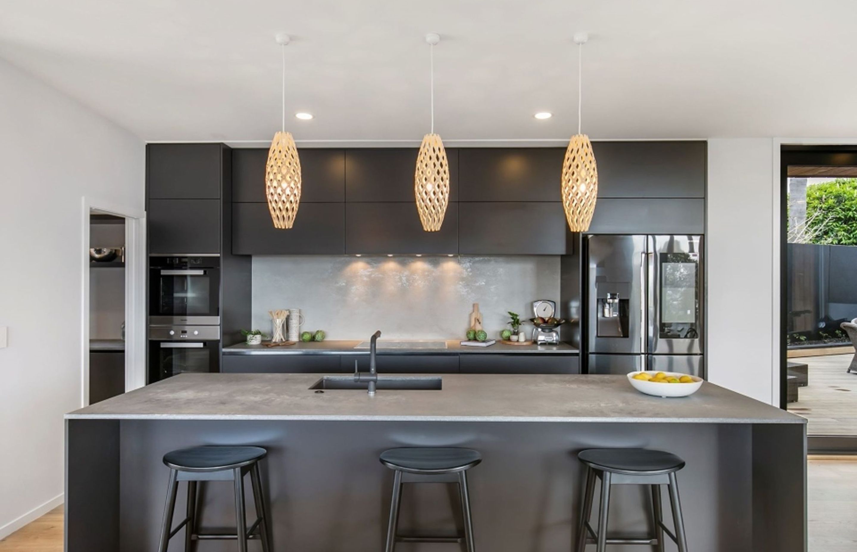 The traditional 'black and white' colour scheme has been given a modern twist in the kitchen, which also features a butler's pantry.