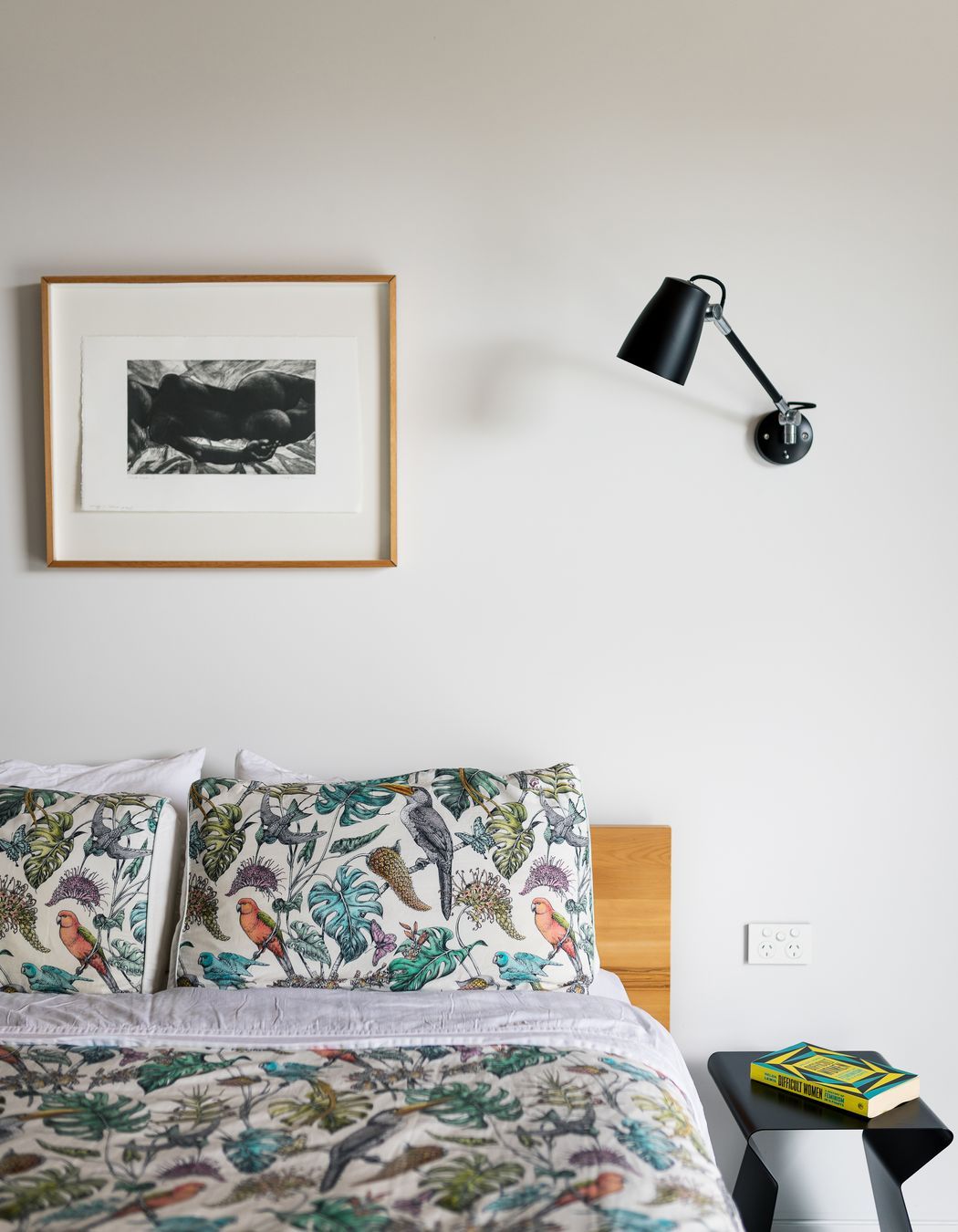 The house has four bedrooms, two bathrooms and a powder room. The walls are painted in Resene Snowdrift, which is offset by all steel being painted in Resene Nero.