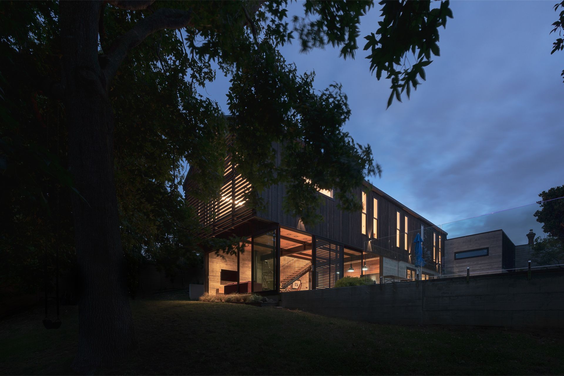 “Because all the upstairs rooms are single-sided you can’t achieve cross flow ventilation. So we used double hung sashes, like you get in the old villas, which allow hot air to exit at the top as cool air comes in the bottom.” The added benefit of a large patio is the family can plan outdoor movie nights: the concrete lower portion of the garage wall was always intended to serve as an outdoor screen.