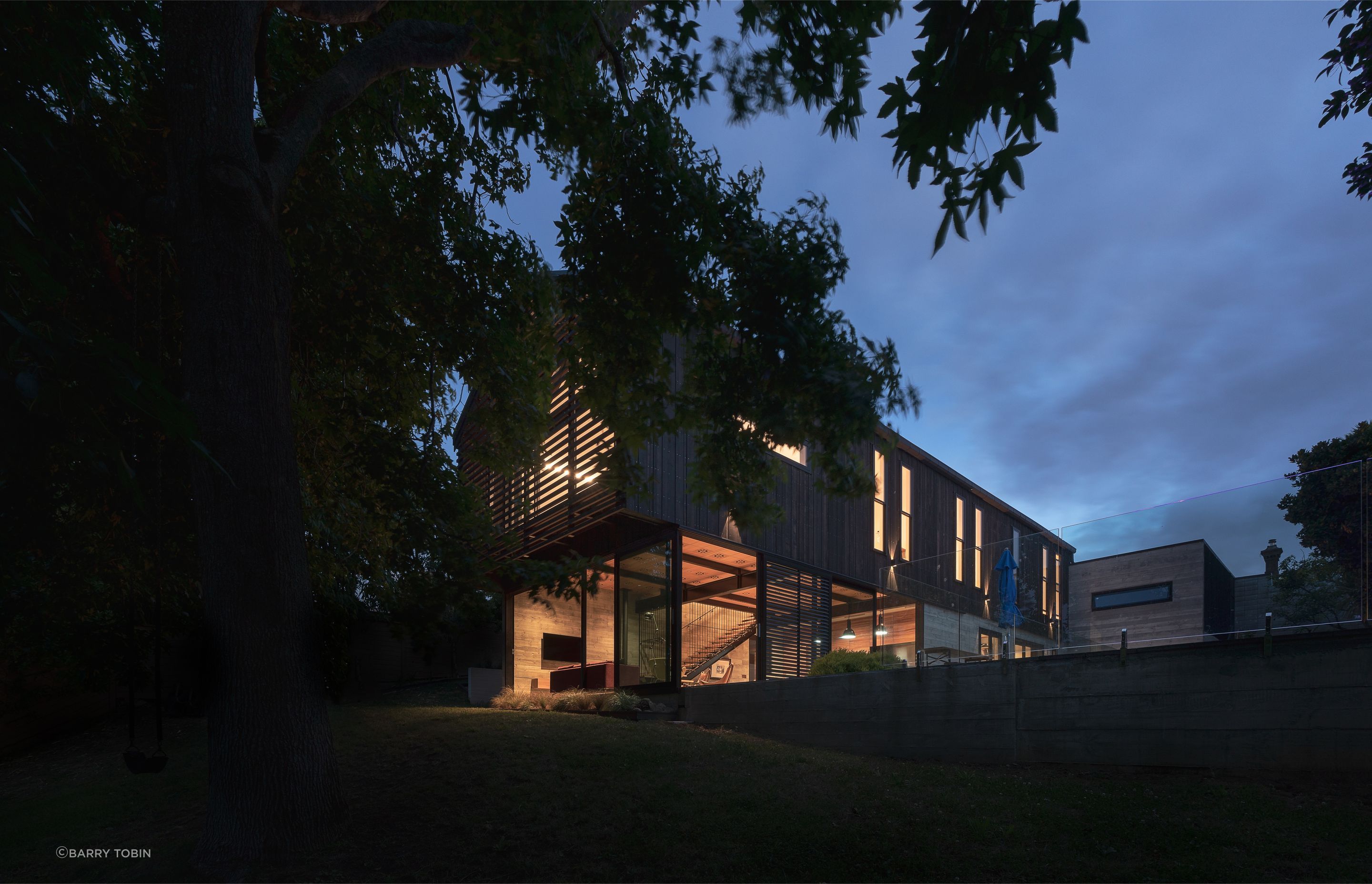 “Because all the upstairs rooms are single-sided you can’t achieve cross flow ventilation. So we used double hung sashes, like you get in the old villas, which allow hot air to exit at the top as cool air comes in the bottom.” The added benefit of a large patio is the family can plan outdoor movie nights: the concrete lower portion of the garage wall was always intended to serve as an outdoor screen.