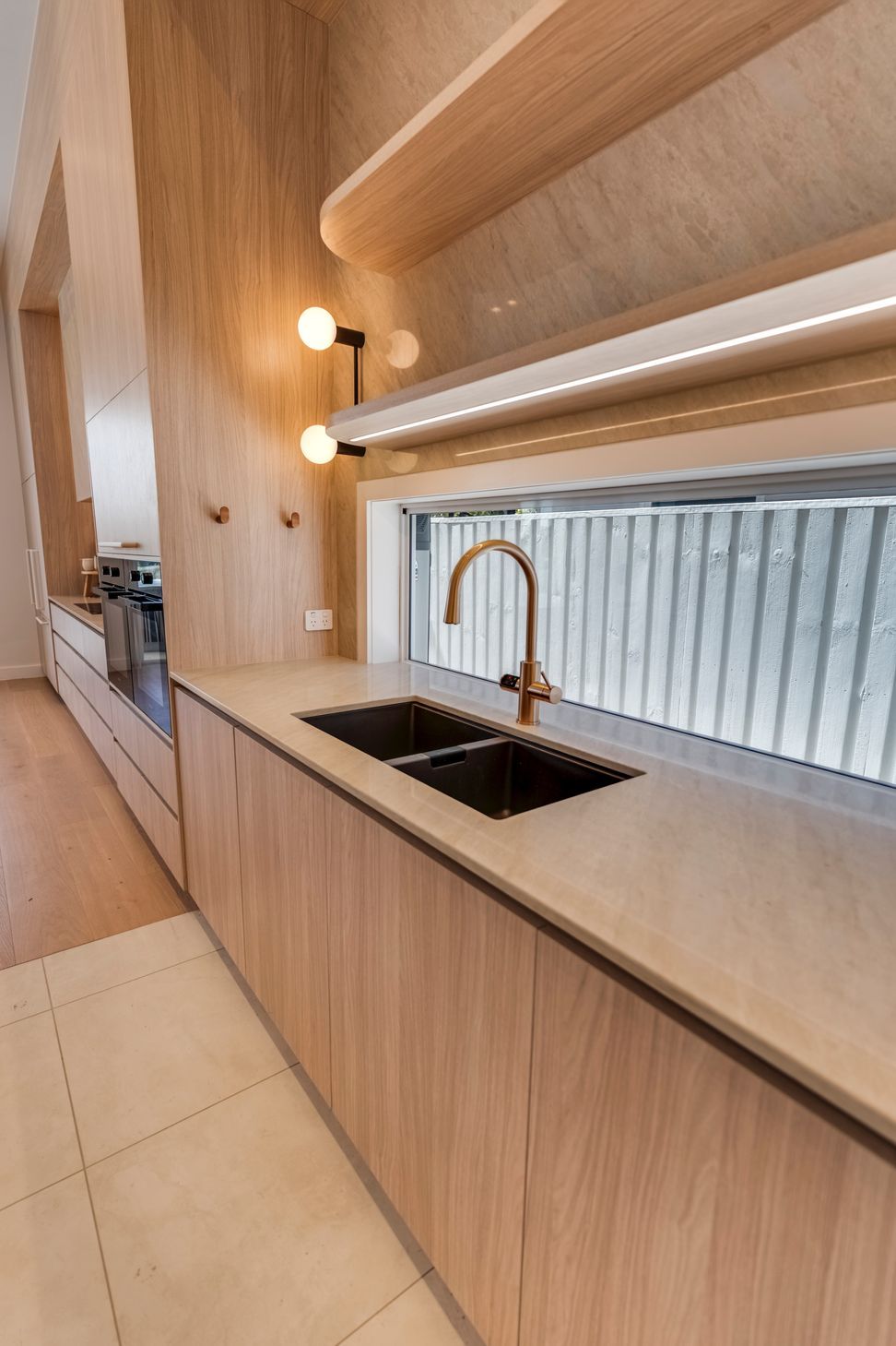 A detached studio and covered kitchen frame the pool at the rear of the block.