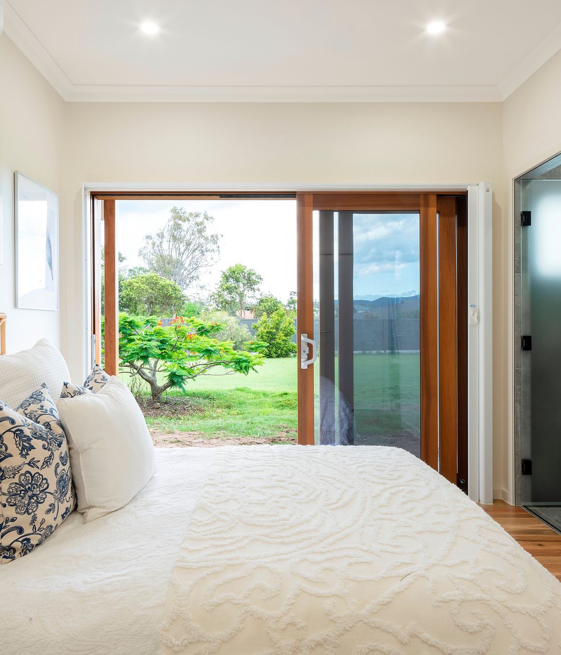 The bedroom is designed to allow a bedbound person to still experience a visual connection to the land. It is protected from western sun while still welcoming a generous winter warming. Photo:®Angus Martin