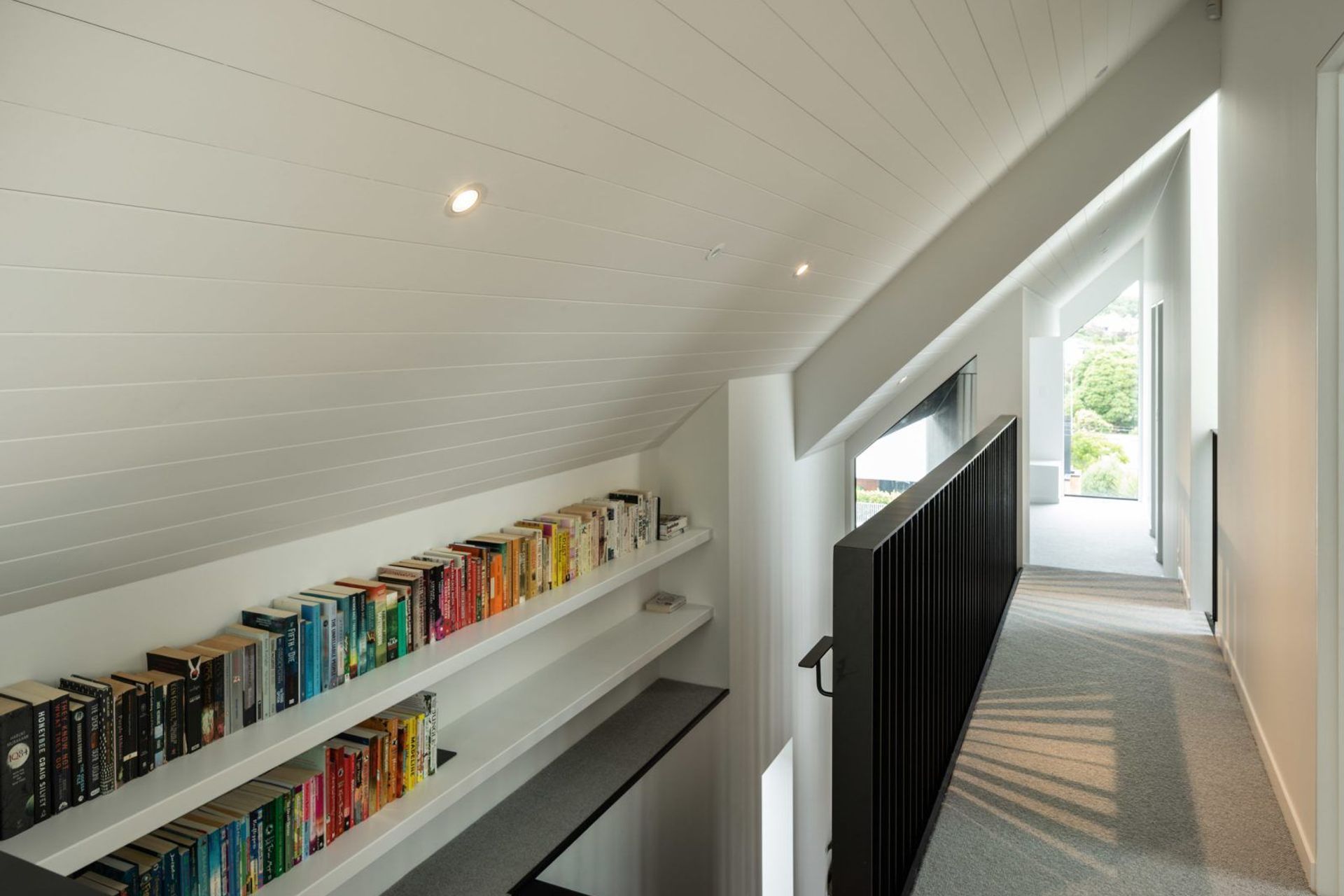 Upstairs space is maximised by tucking the hallway into the slant of the gabled roof.