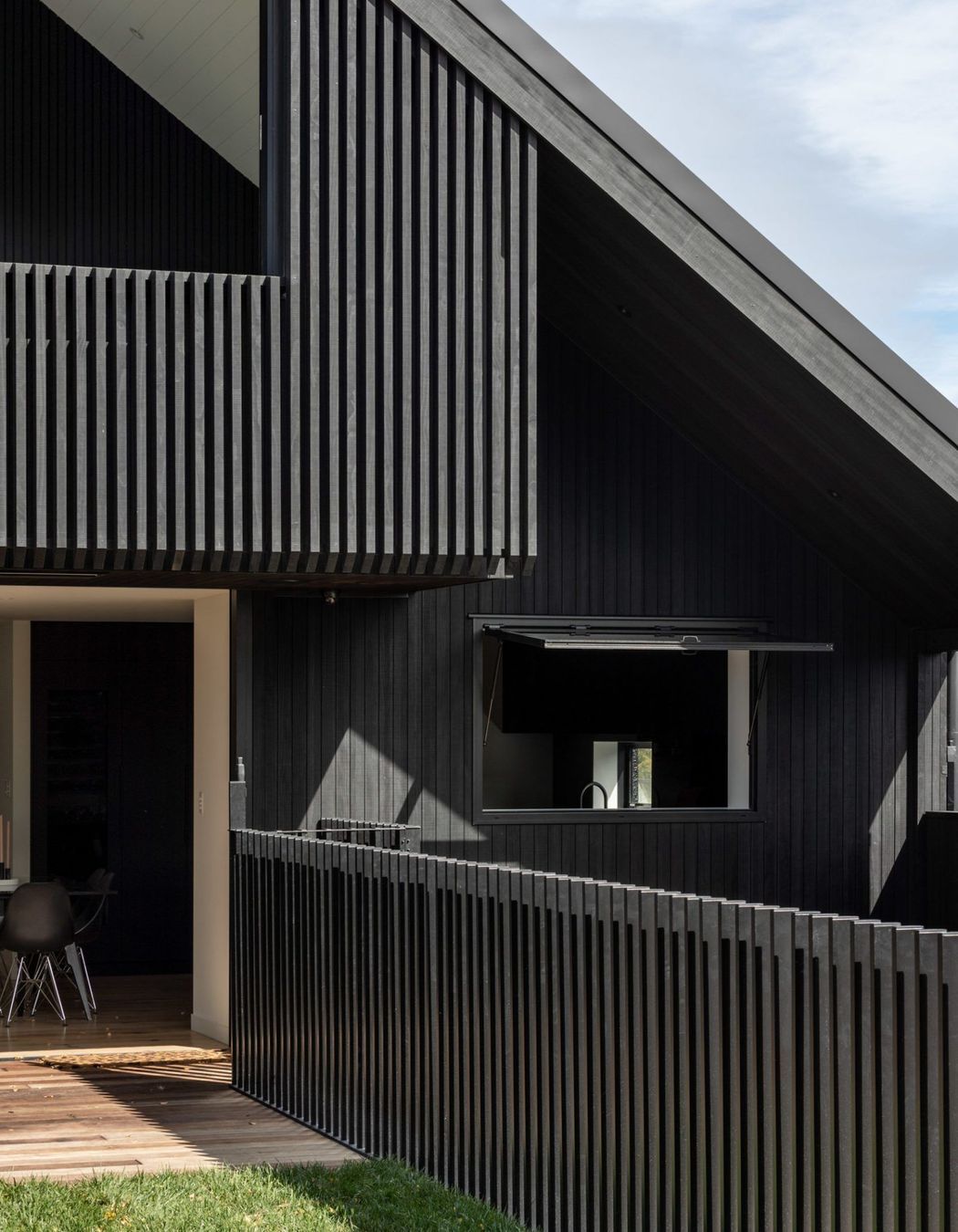 Externally, the home is bold and striking, while internally it's warm and light.