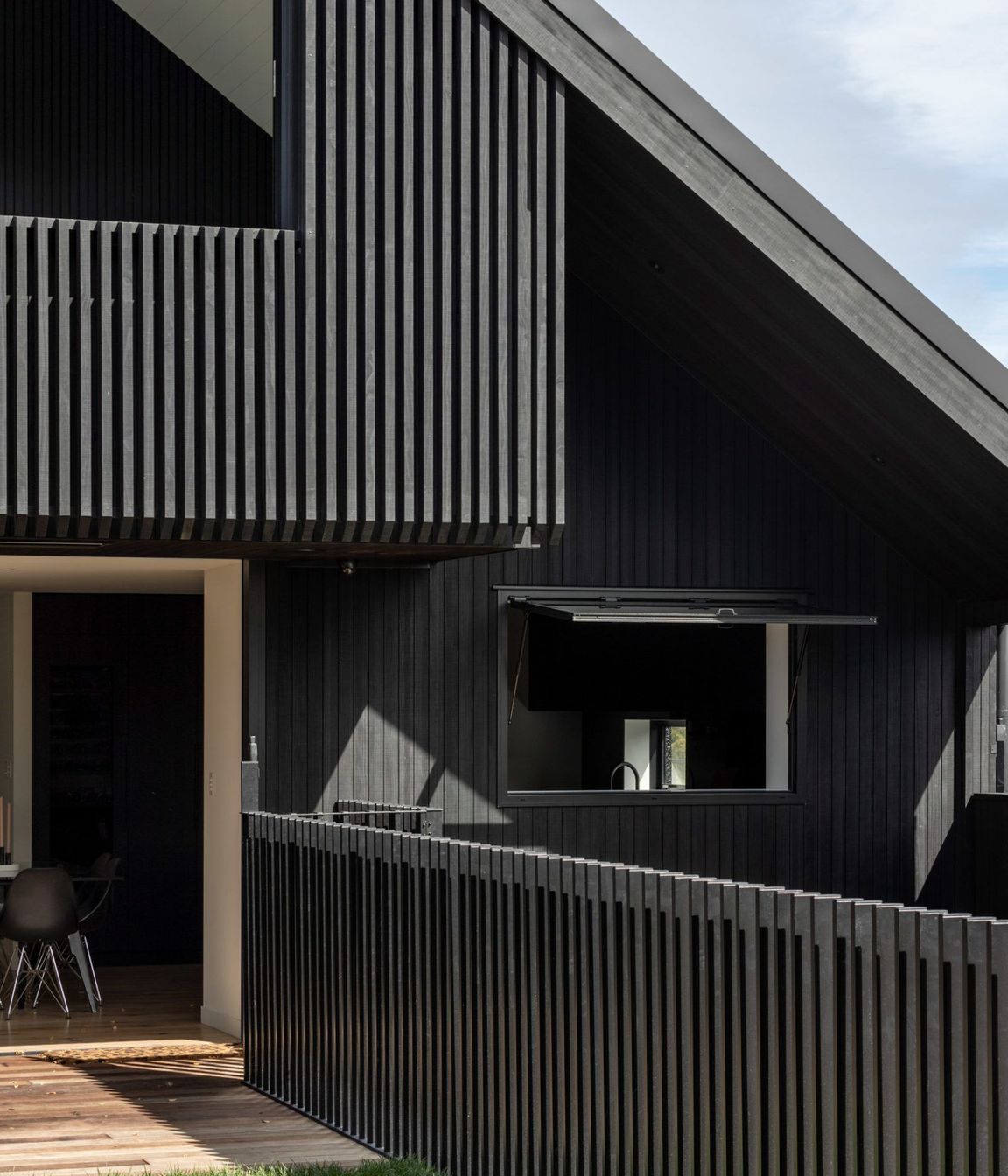 Externally, the home is bold and striking, while internally it's warm and light.