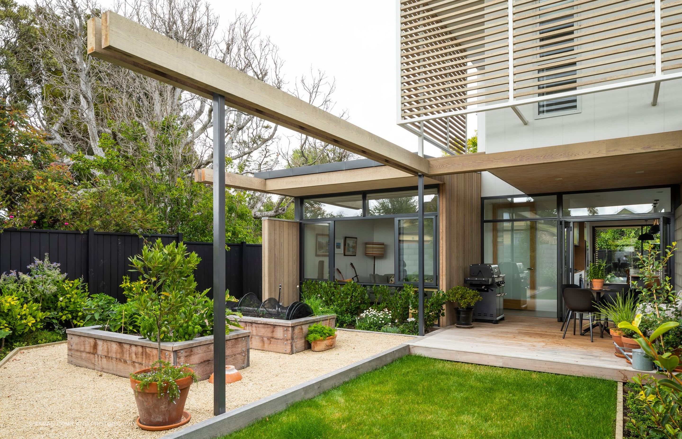 The connection between indoors and outdoors has been visually reinforced through the use of colonnaded pergolas that extend out into the environment.