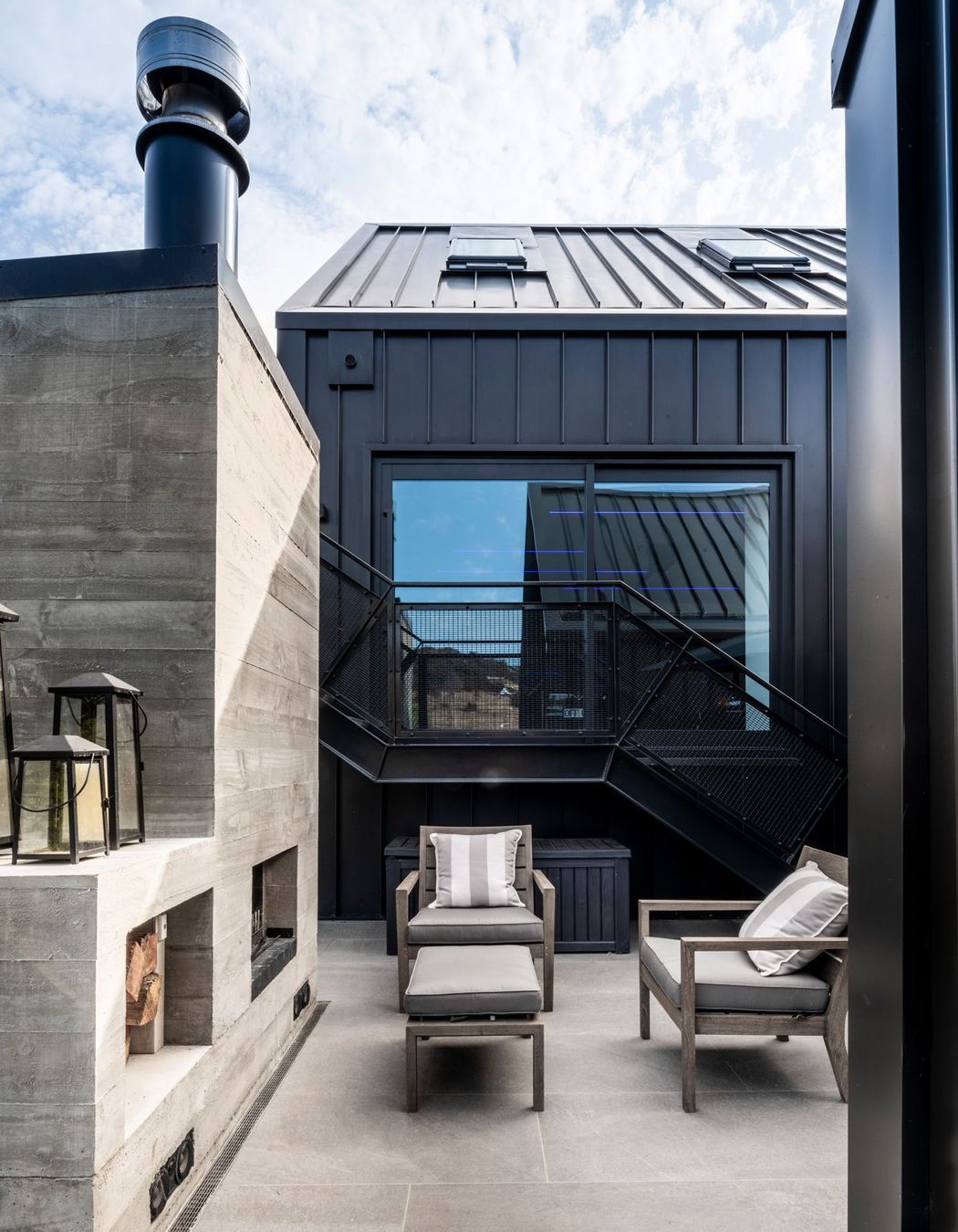 This outdoor fireplace and entertaining area is tucked into a sheltered courtyard off the back of the central hallway.