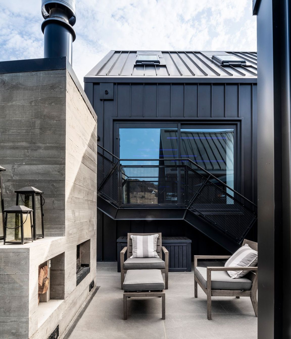 This outdoor fireplace and entertaining area is tucked into a sheltered courtyard off the back of the central hallway.