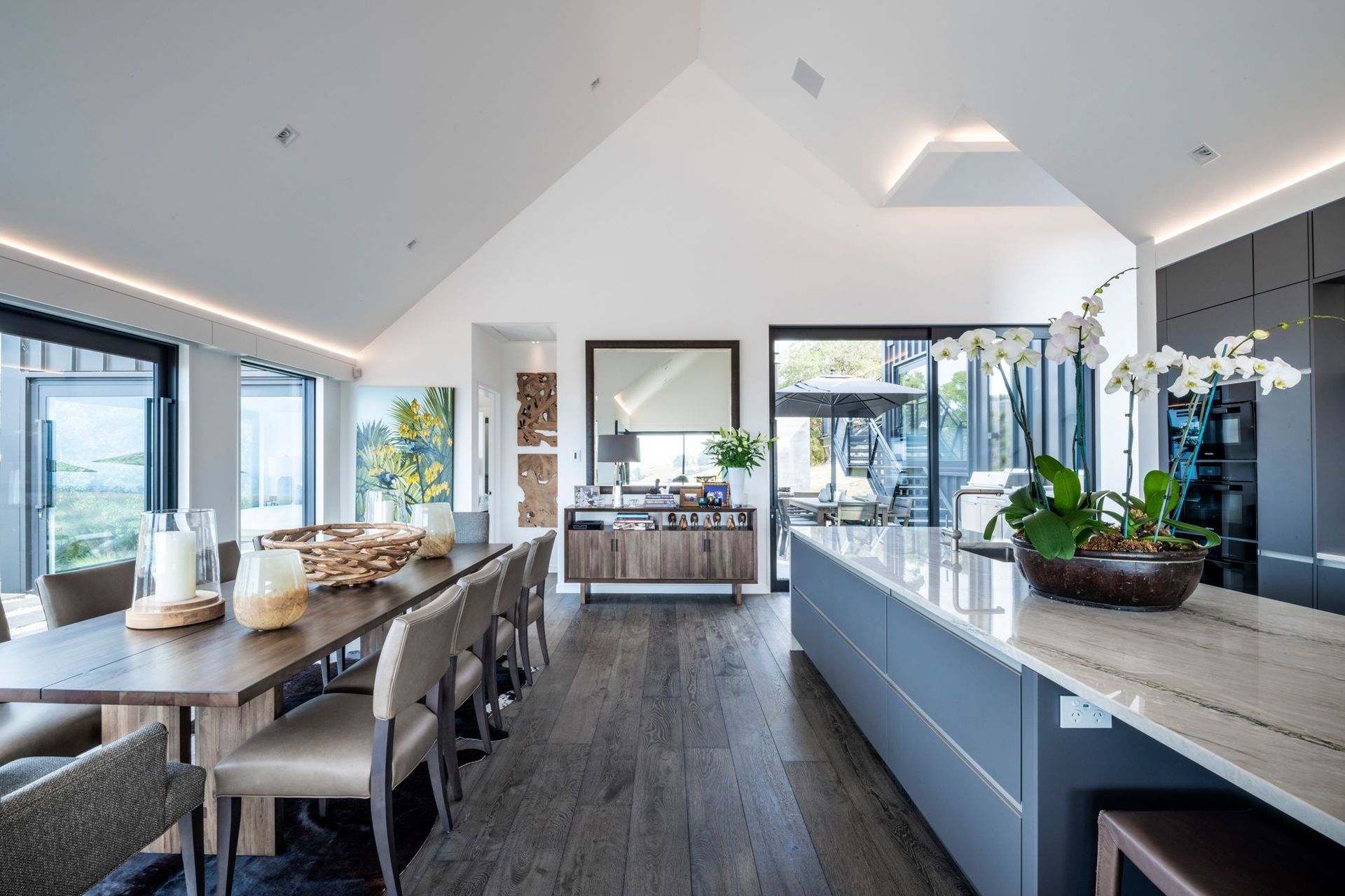 The kitchen and dining space is open plan and connects to the living space. The master bedroom leads off from the bottom of this space.