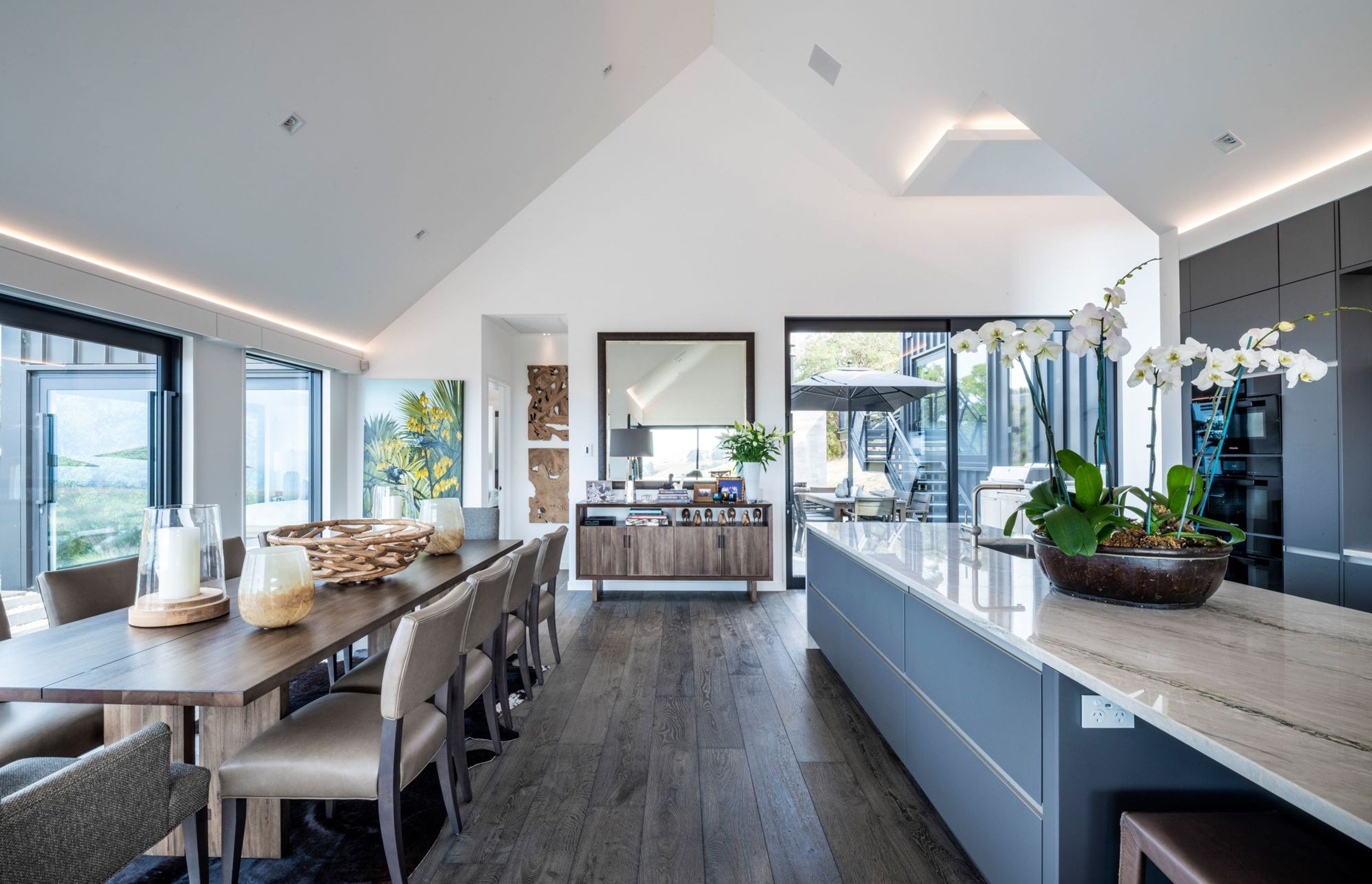 The kitchen and dining space is open plan and connects to the living space. The master bedroom leads off from the bottom of this space.