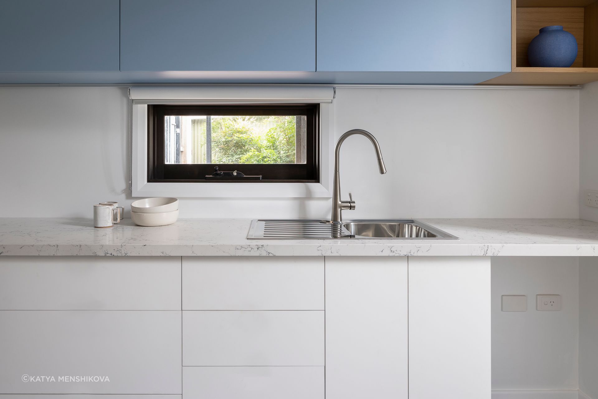 Cool blue, clean kitchenette