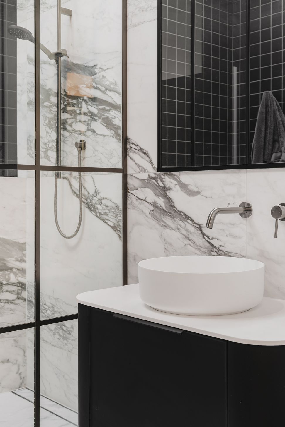 Westmere Bungalow | New-Build Residence | Internal view of ensuite bathroom in master suite. Featuring lare profile Italian marble tile and glass and aluminium shower door.