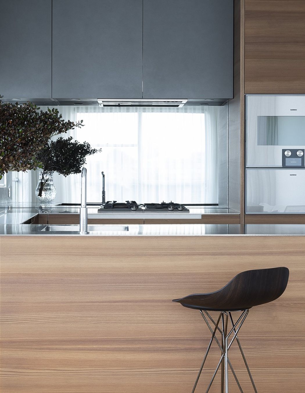 Left: Phoenix kitchen with Harmony Stool pulled up to the bench. Right: Poliform inserts, customised for the small format kitchen bench.