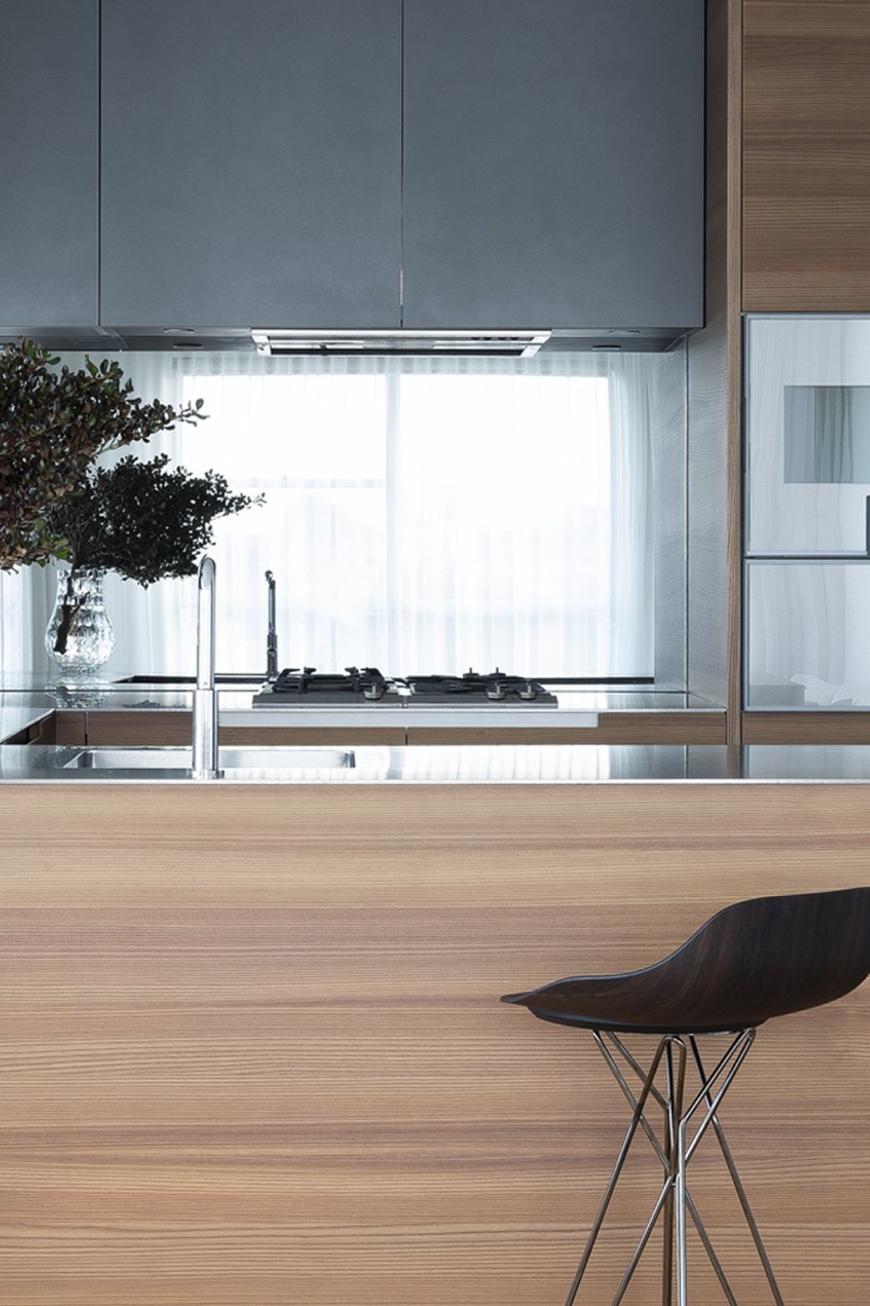 Left: Phoenix kitchen with Harmony Stool pulled up to the bench. Right: Poliform inserts, customised for the small format kitchen bench.