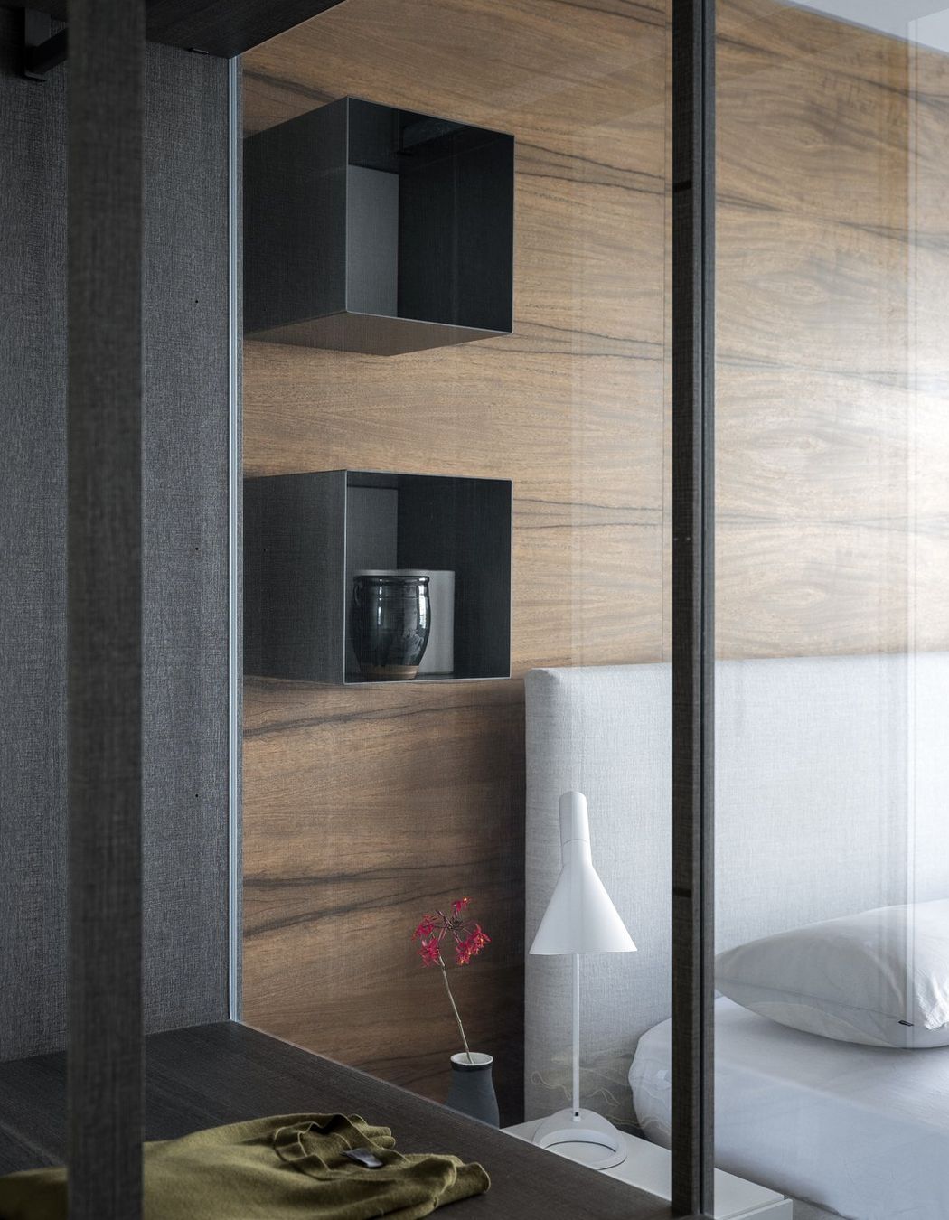 Left: Poliform Ego walk in robe and right the Arca bed and Dream side table also by Poliform.