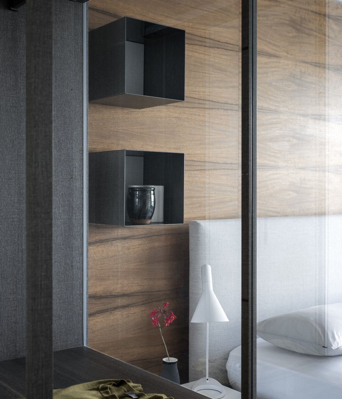 Left: Poliform Ego walk in robe and right the Arca bed and Dream side table also by Poliform.