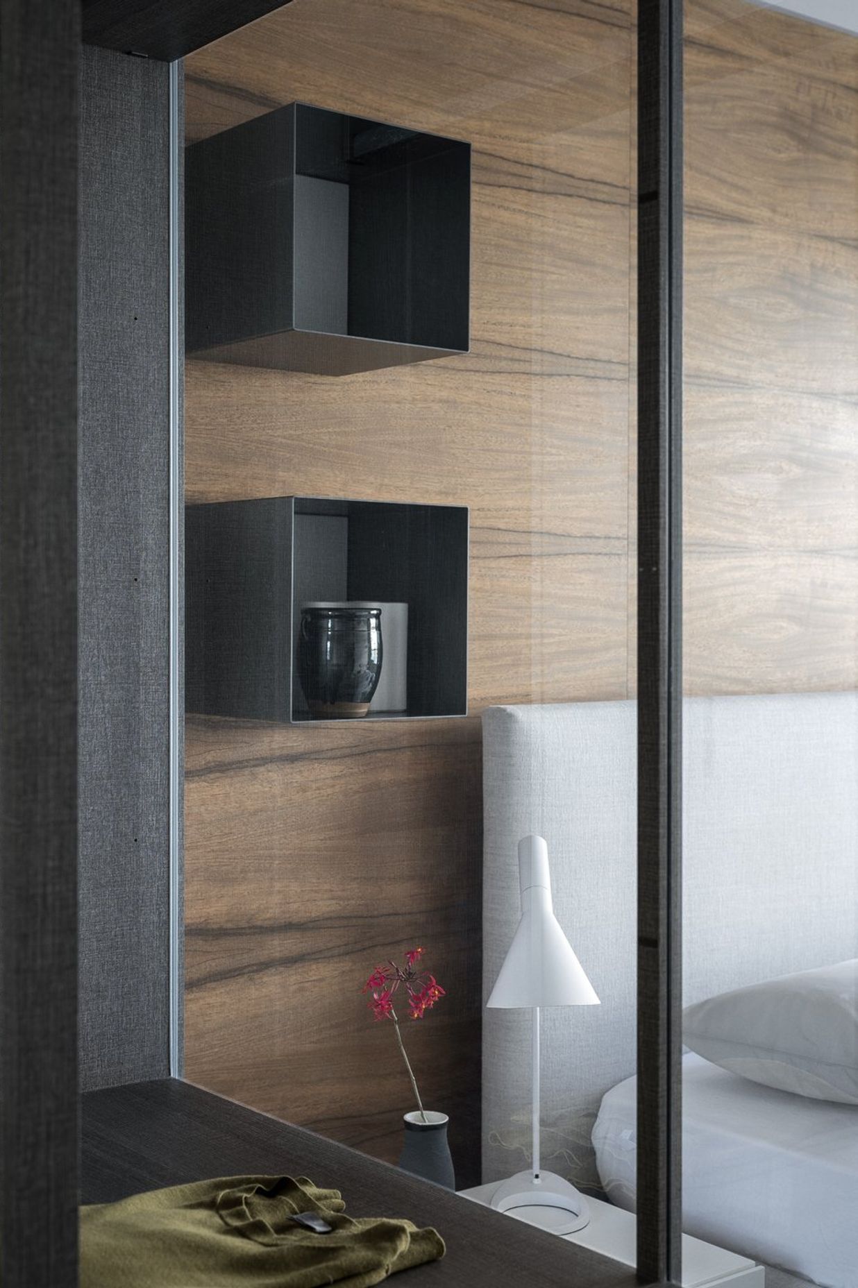 Left: Poliform Ego walk in robe and right the Arca bed and Dream side table also by Poliform.
