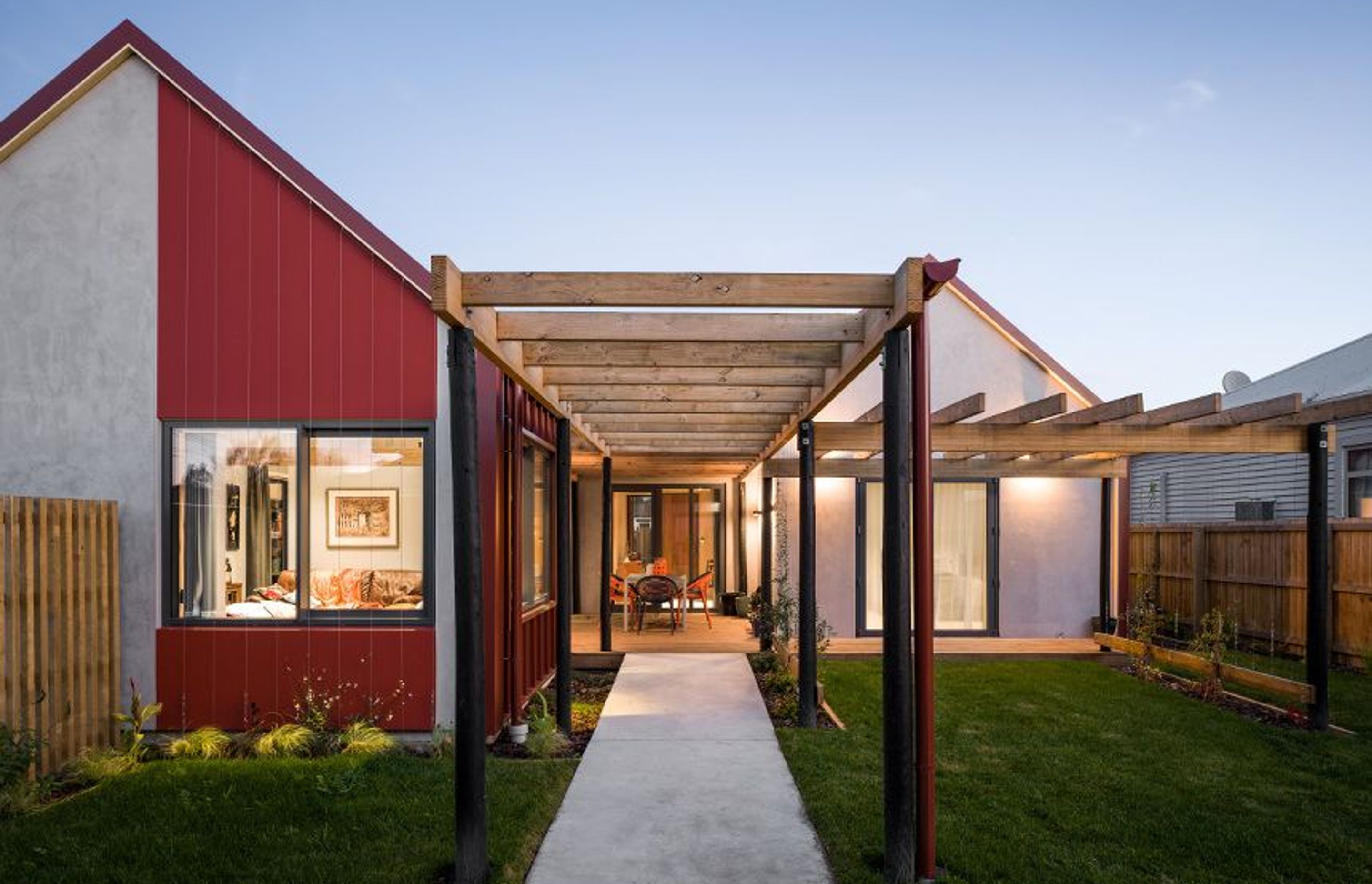 The design for this house, completed by architectural graduate Joshua Dubbeld, presents as two independent gables connected by a flat-roofed vestibule.