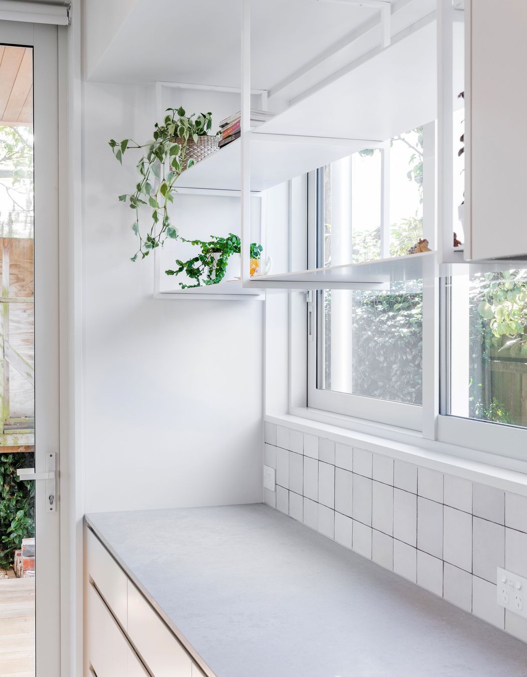 The neutral materiality of the interior will allow it to grow adapt with the homeowners.