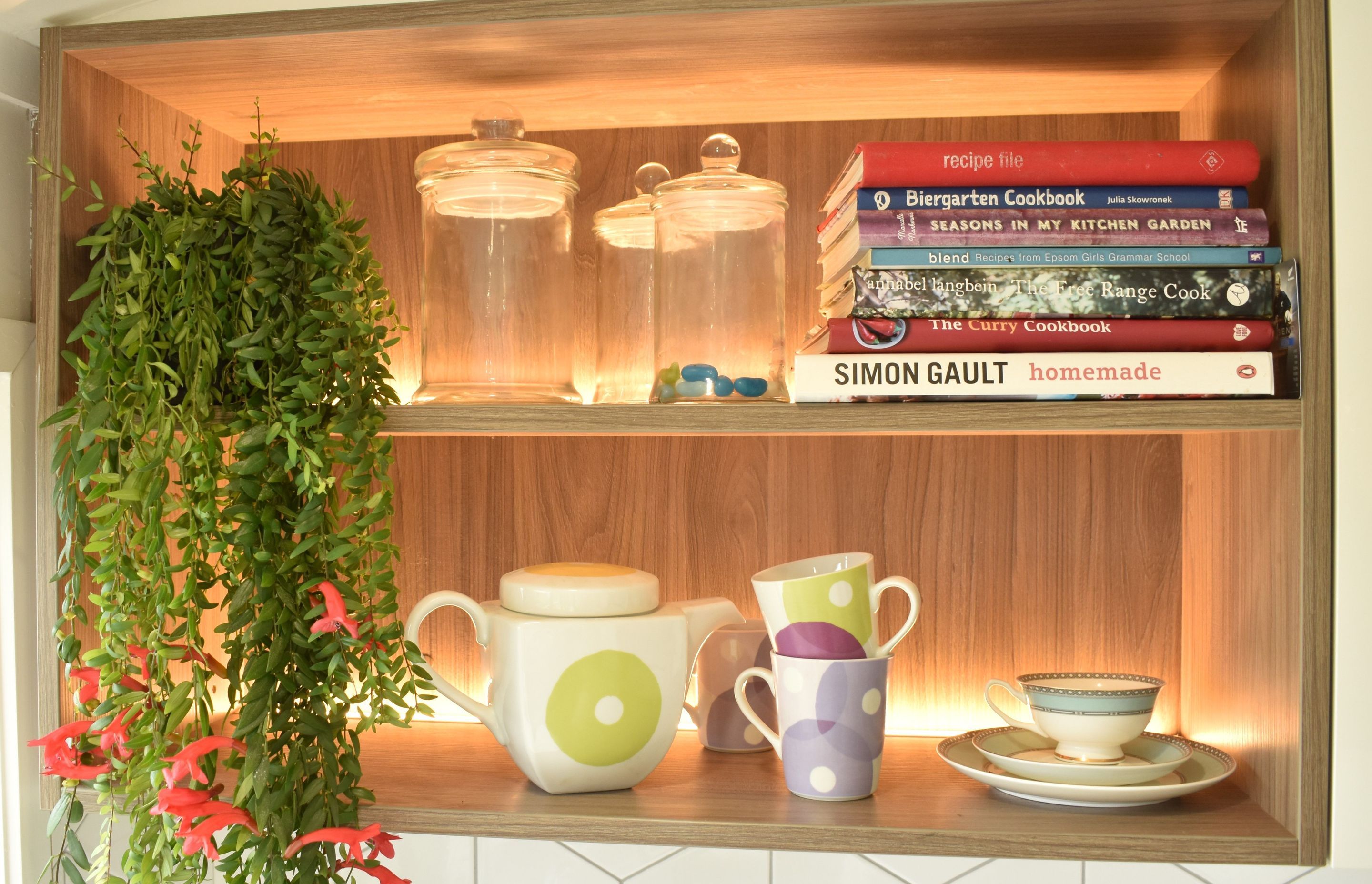 LED lighting in behind the woodgrain open shelving bought the unit to life