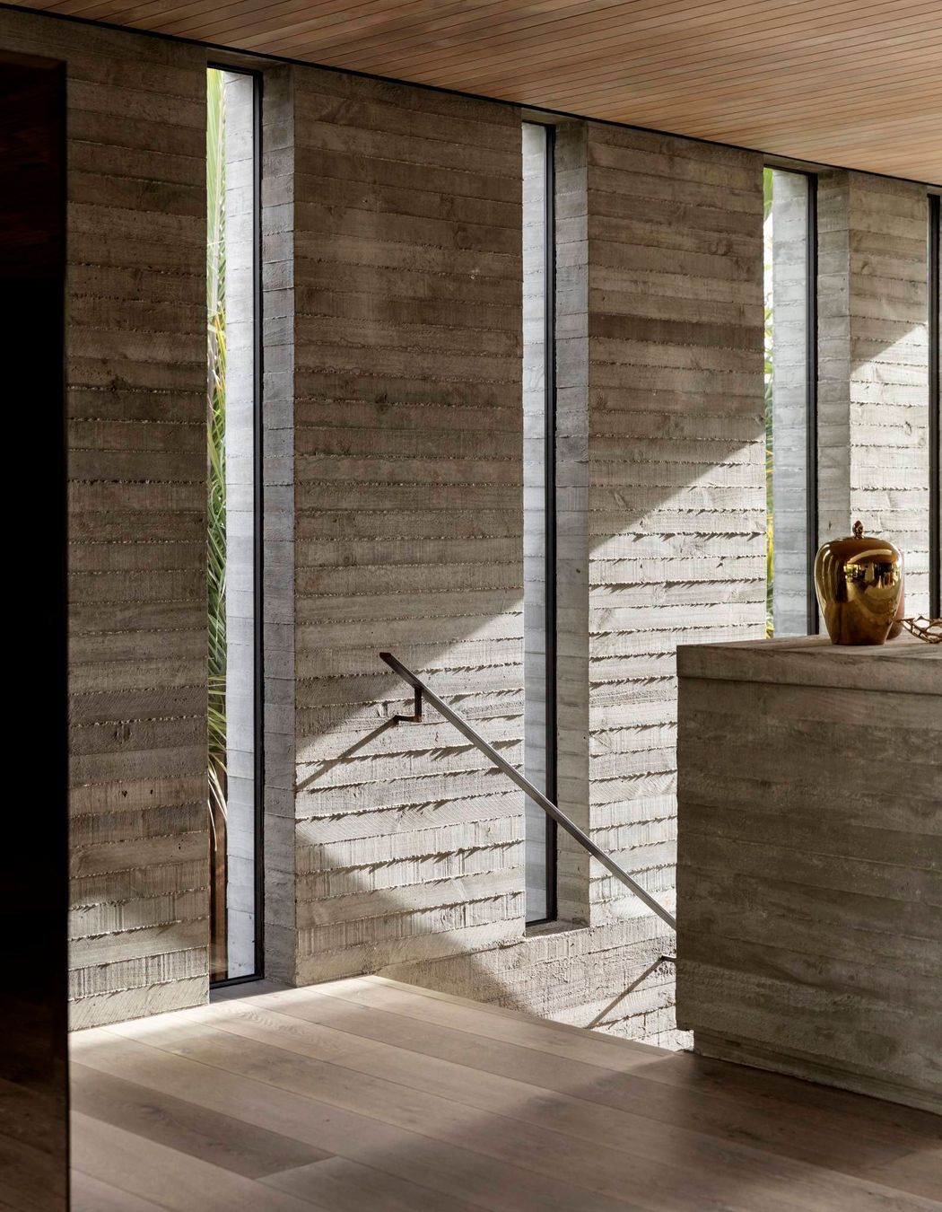 Given the proximity of neighbours on both the northern (shown) and southern boundaries, the architect created a series of cut-outs to retain privacy but to also admit natural light and connect the house to the plantings on that side.