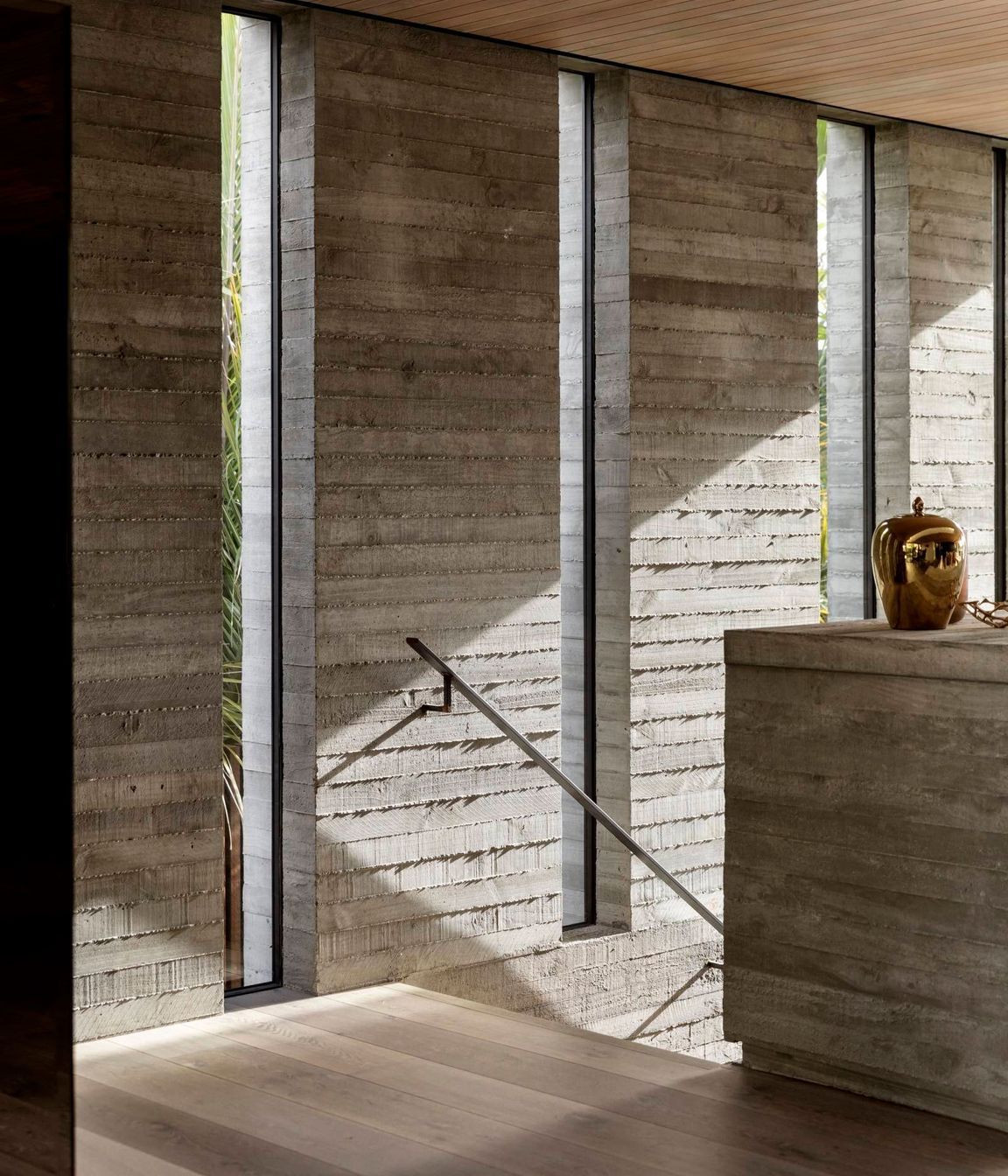 Given the proximity of neighbours on both the northern (shown) and southern boundaries, the architect created a series of cut-outs to retain privacy but to also admit natural light and connect the house to the plantings on that side.