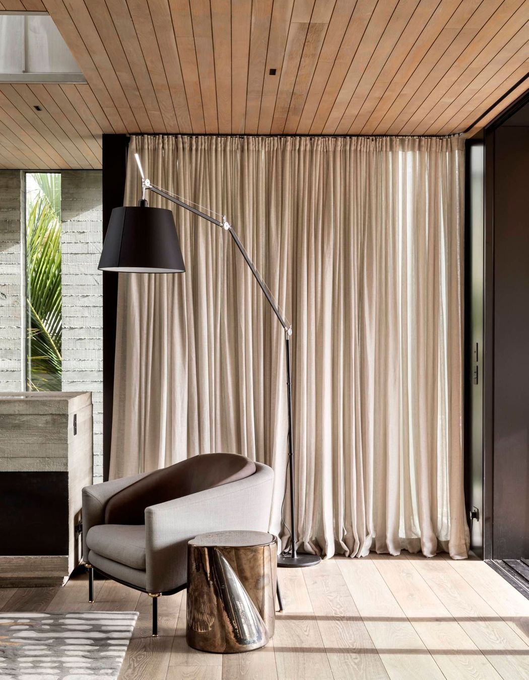 Oak flooring and ceiling battens continue the theme of natural materials and counterbalance the insitu concrete.