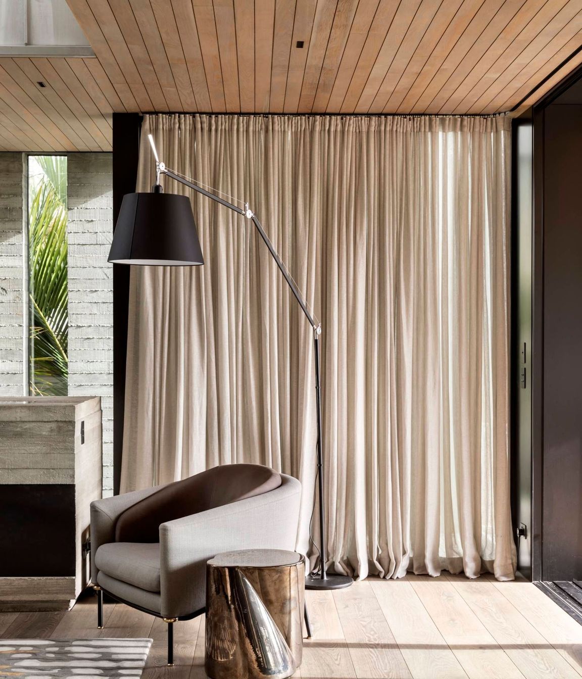 Oak flooring and ceiling battens continue the theme of natural materials and counterbalance the insitu concrete.
