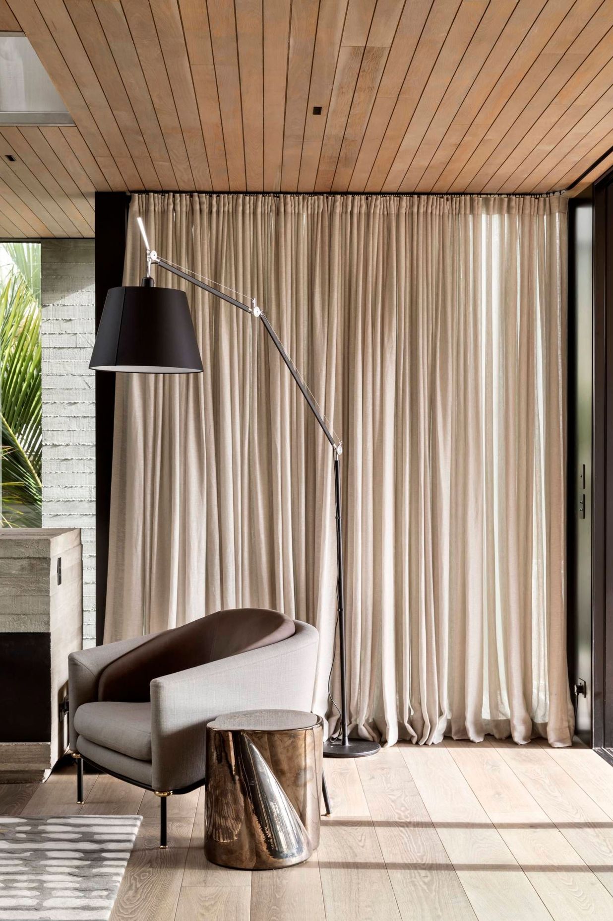 Oak flooring and ceiling battens continue the theme of natural materials and counterbalance the insitu concrete.