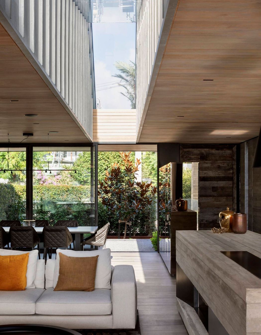 The 'notch' skylight runs the full depth of the living area and extends upwards the entire height of the upper floor.