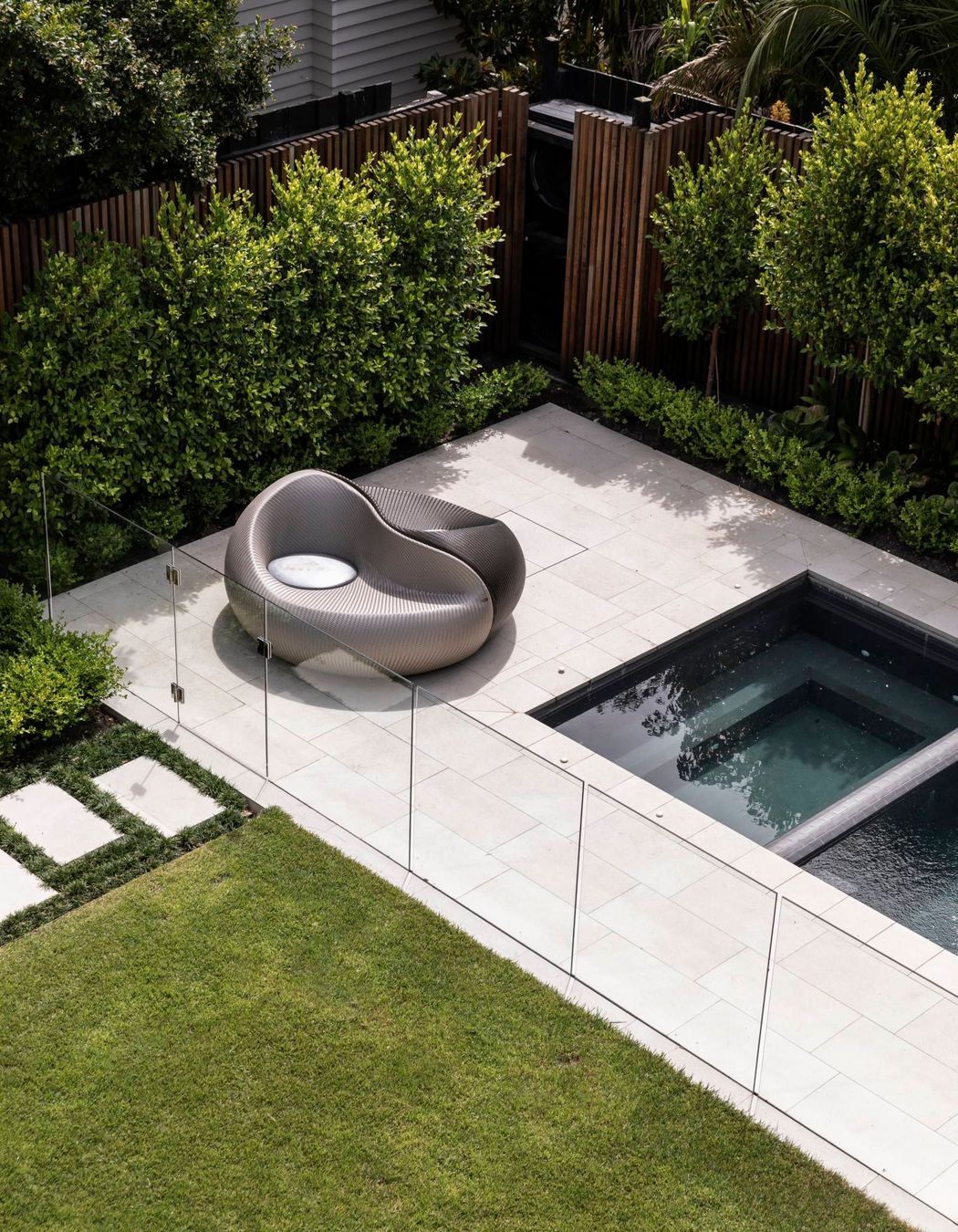 The back yard underwent retaining works to create a level lawn and area for a spa and swimming pool.