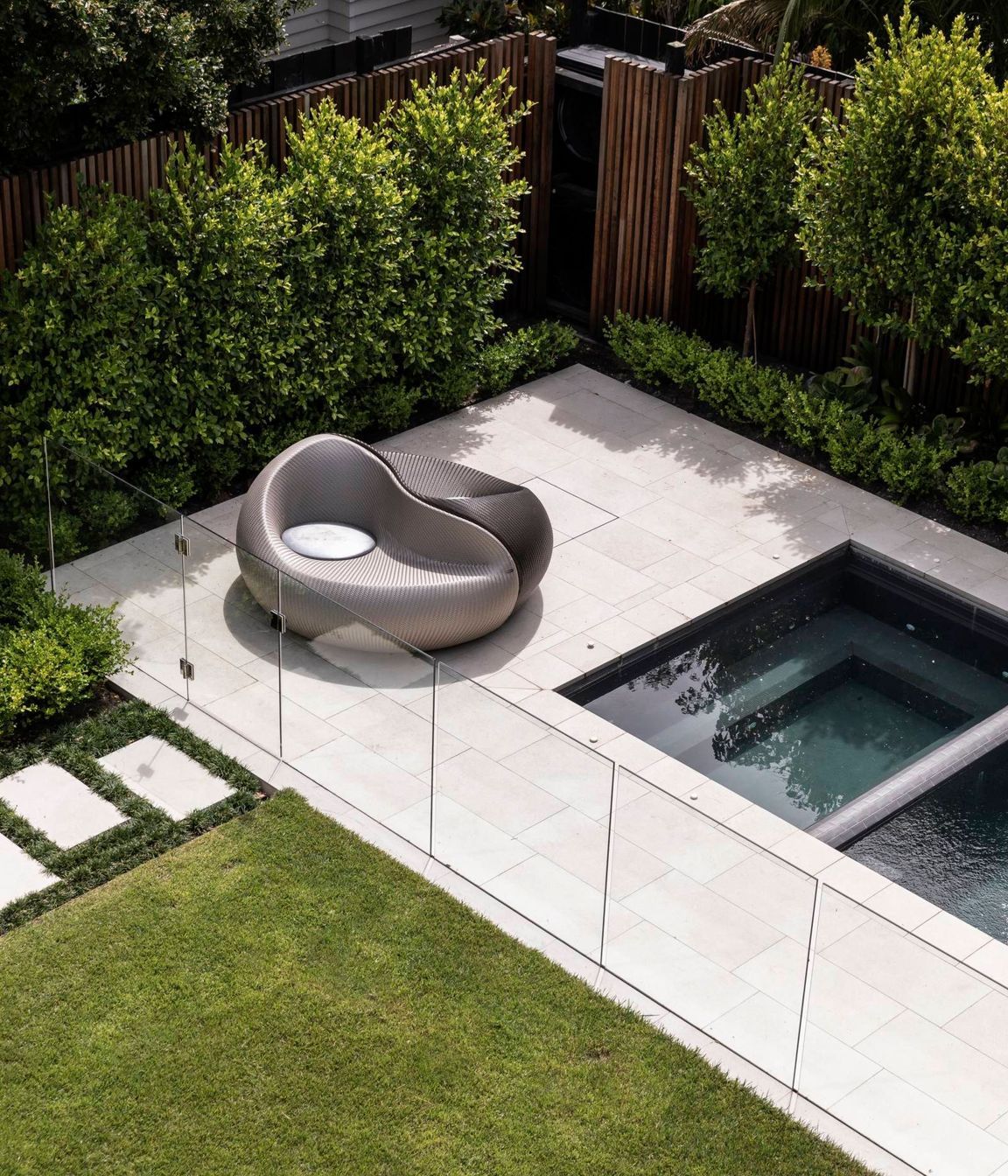 The back yard underwent retaining works to create a level lawn and area for a spa and swimming pool.