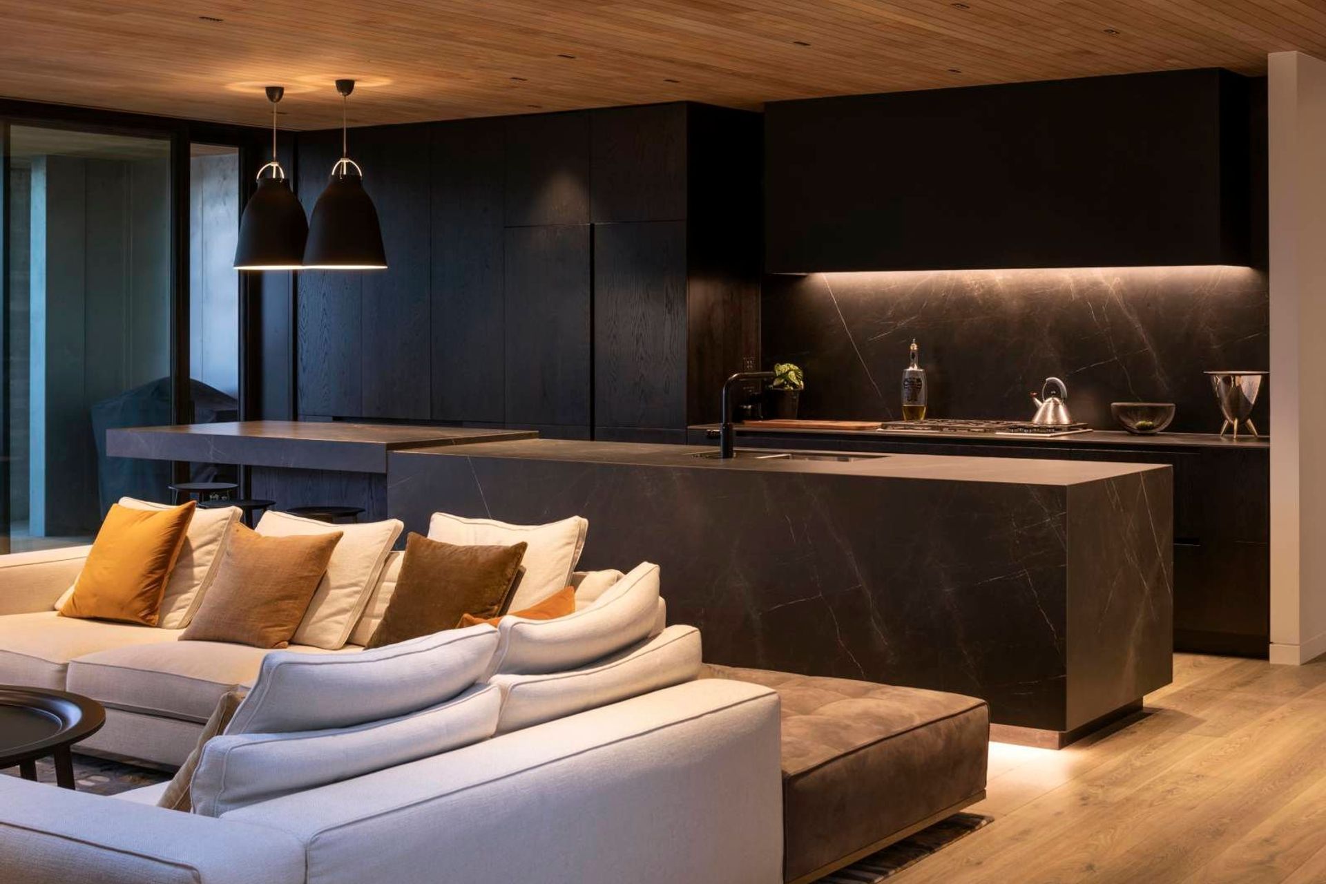 A mix of statement and task lighting helps accentuate the textural elements of the home.