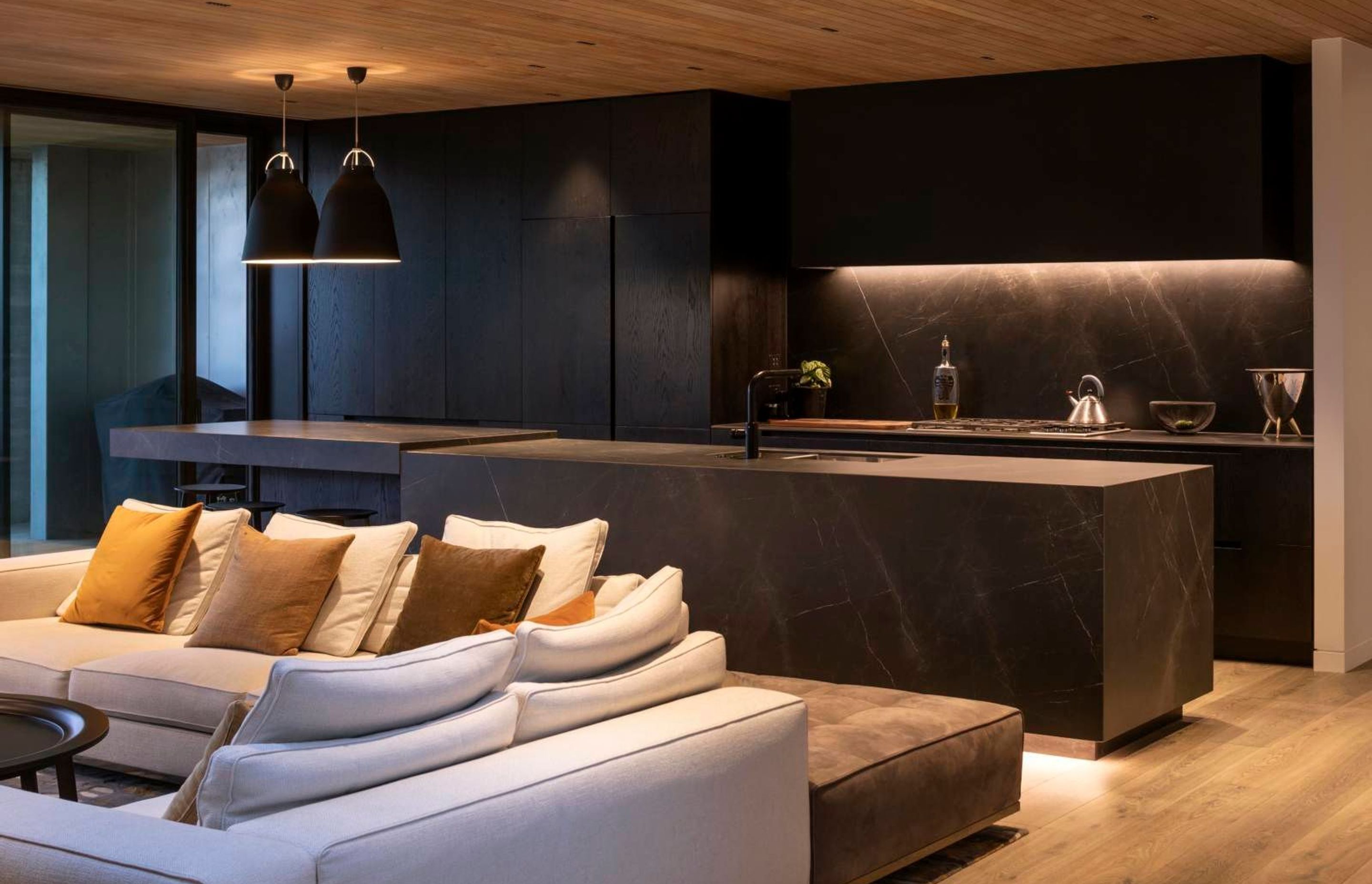 A mix of statement and task lighting helps accentuate the textural elements of the home.