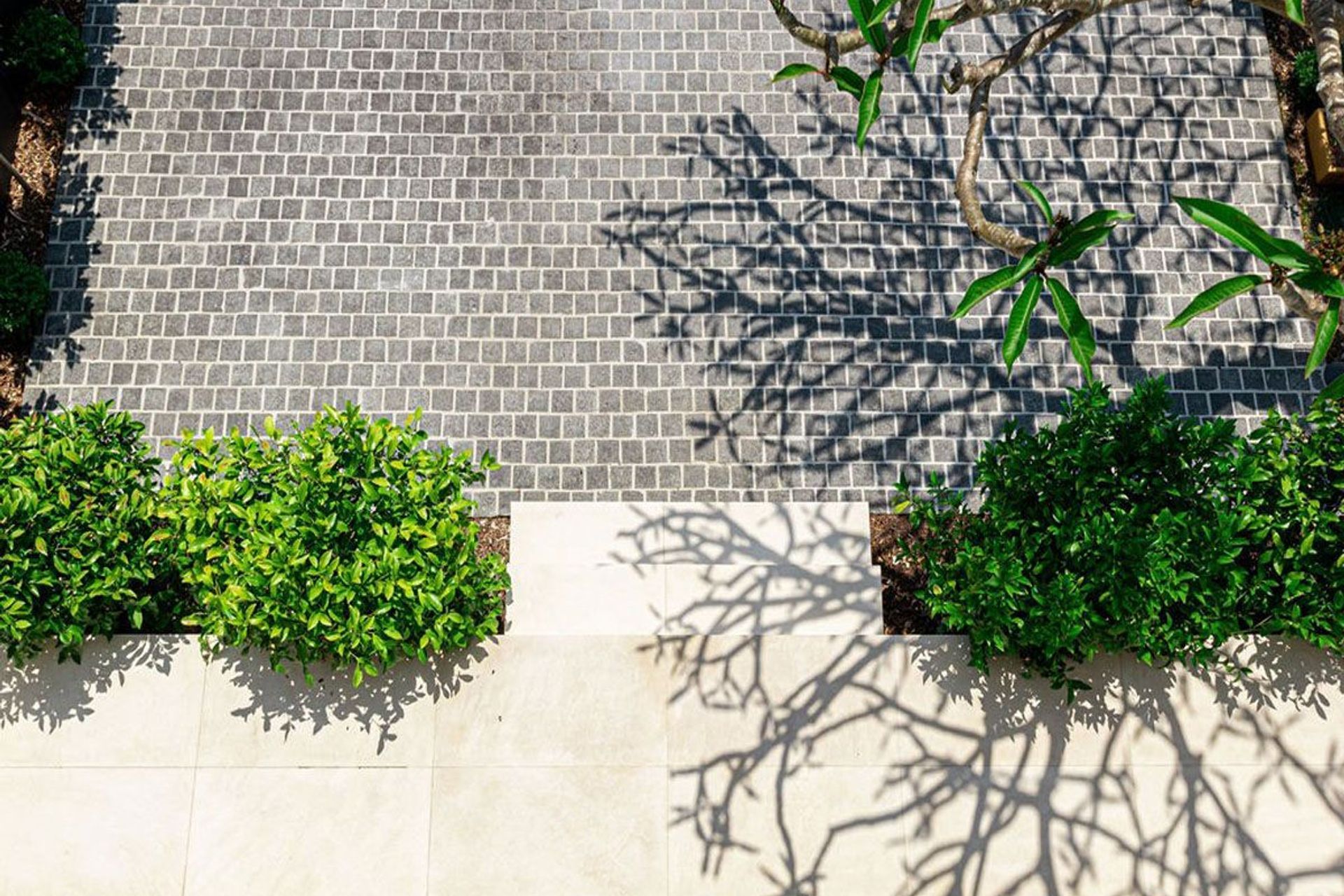 Charcoal Granite Cobblestones | Gardner Design