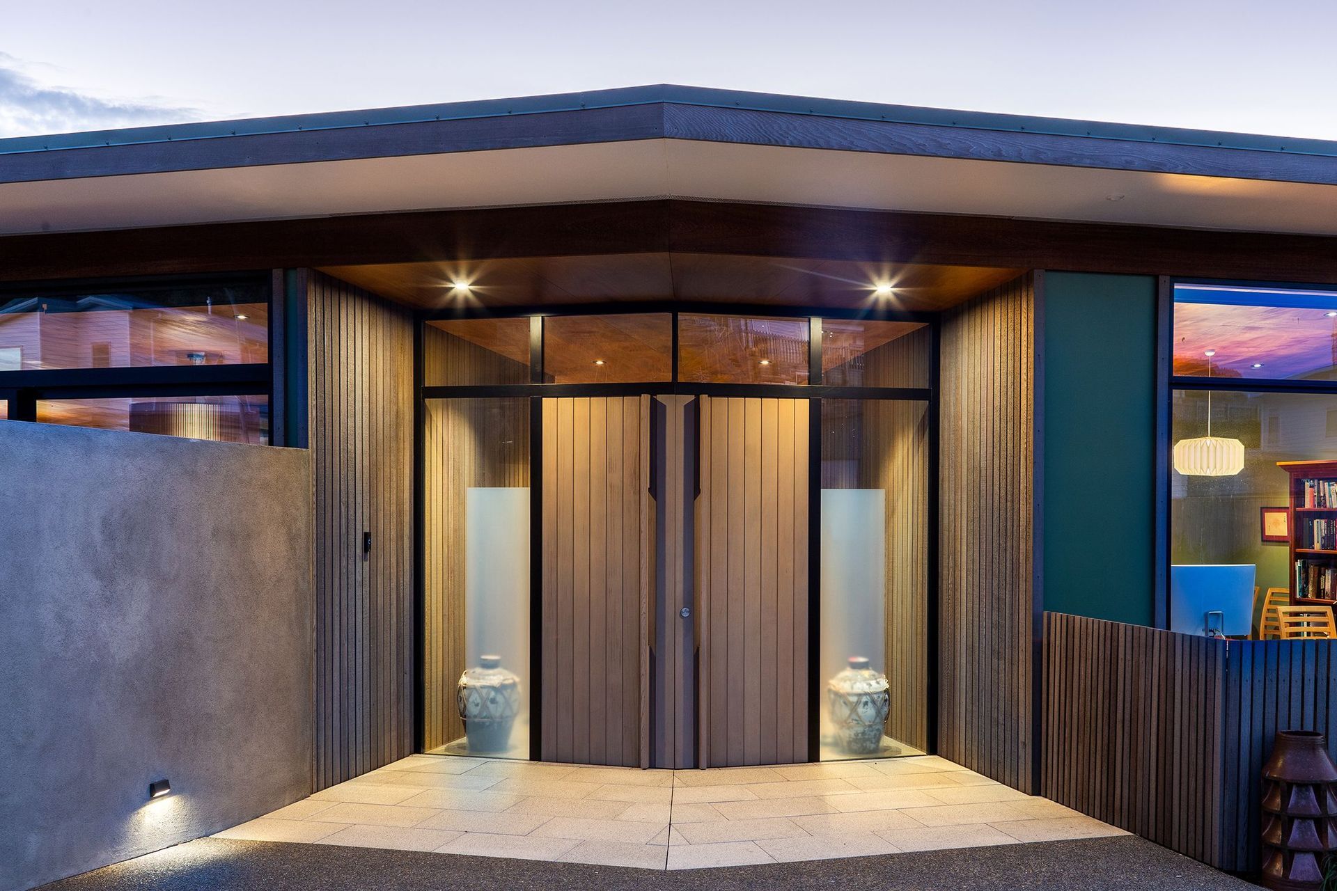 Slightly askew, the house is divided into two wings with the service areas off to the left and the two bedrooms, study and bathrooms off to the right. Open-plan living spaces link the two and open onto sheltered outdoor spaces.