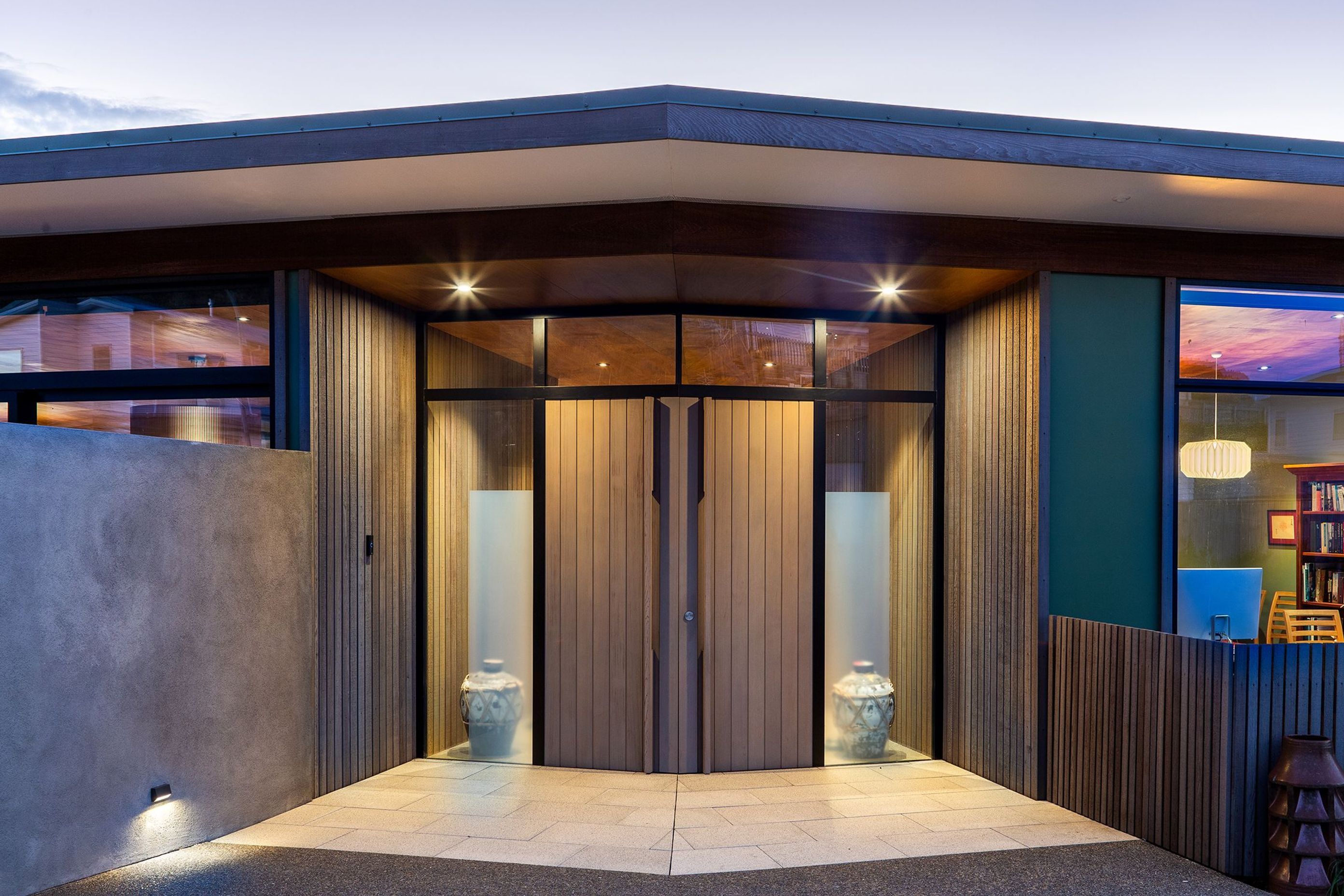 Slightly askew, the house is divided into two wings with the service areas off to the left and the two bedrooms, study and bathrooms off to the right. Open-plan living spaces link the two and open onto sheltered outdoor spaces.
