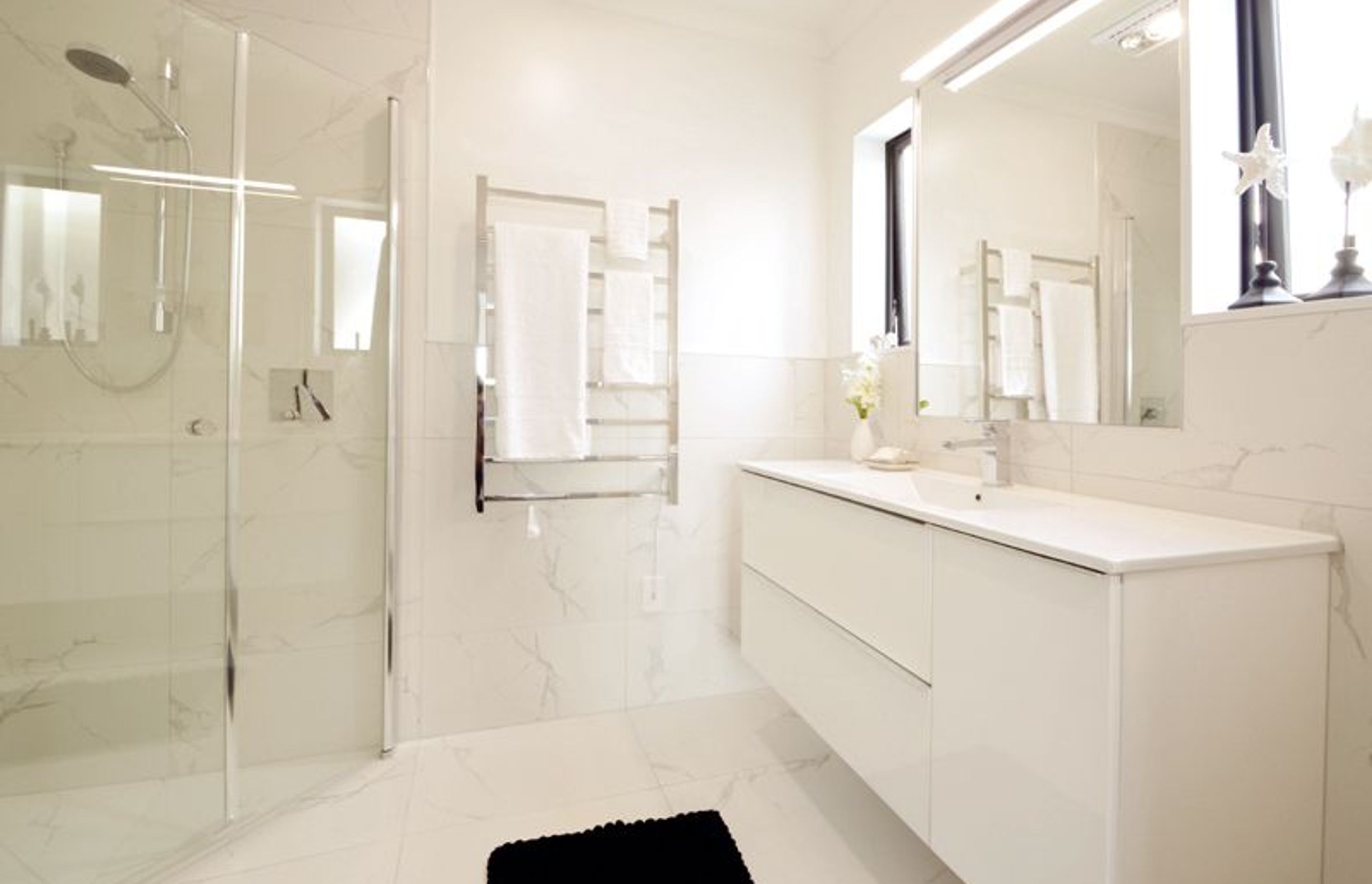 Master Ensuite - Beautiful glamourous master bathroom complete with space saving tiled shower