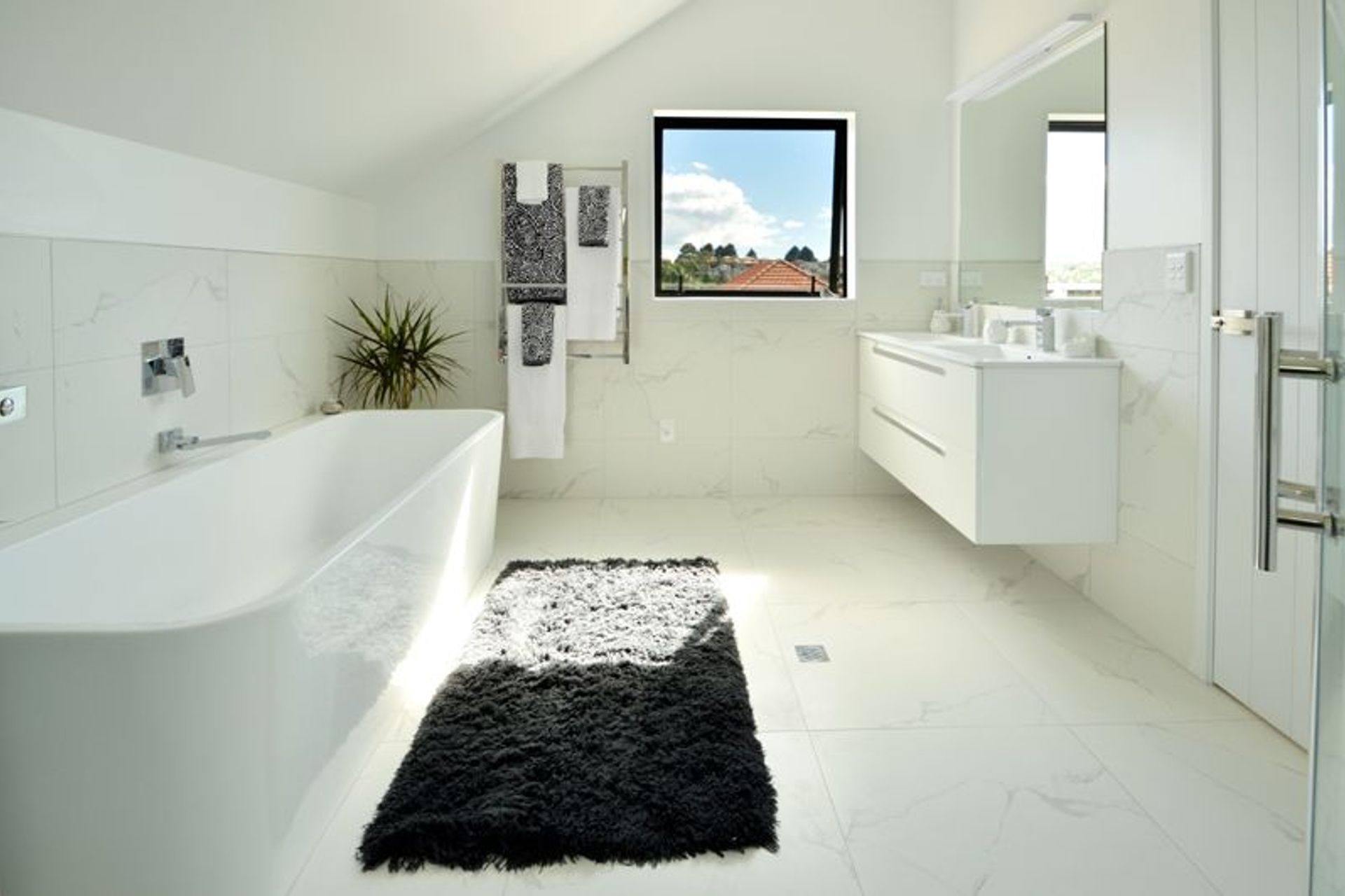 Bathroom - Large upstairs bathroom with double entry from the second master and the family room. This bathroom contains a bath, shower and toilet