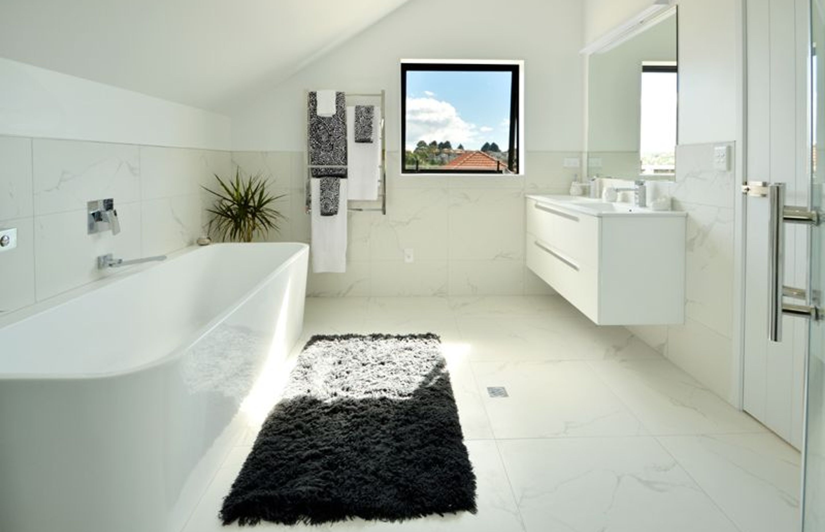 Bathroom - Large upstairs bathroom with double entry from the second master and the family room. This bathroom contains a bath, shower and toilet