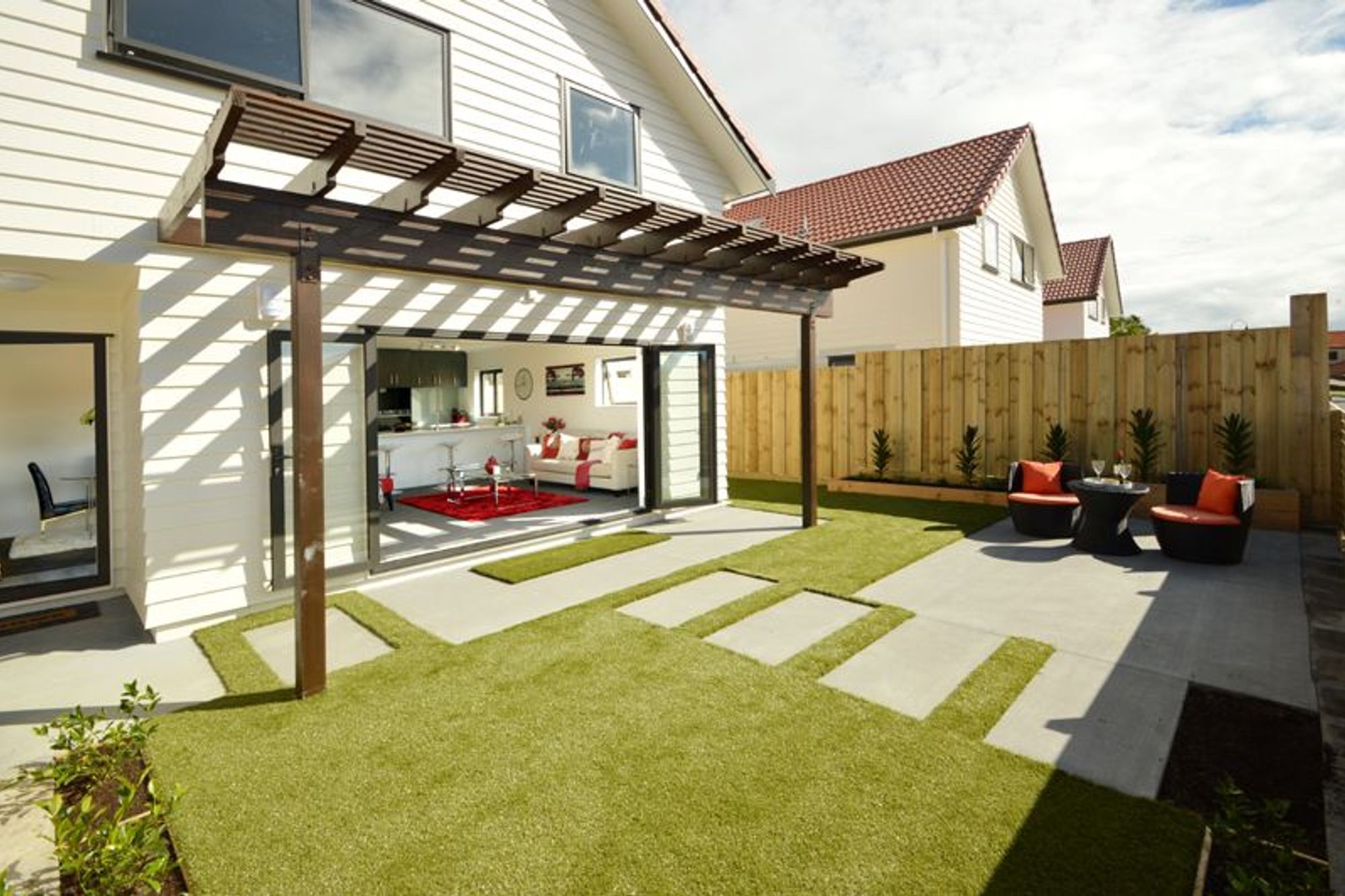 Front Entertaining Area - Beautifully designed north-facing, front entertaining area. The concrete steps cleverly guide you into the living area.