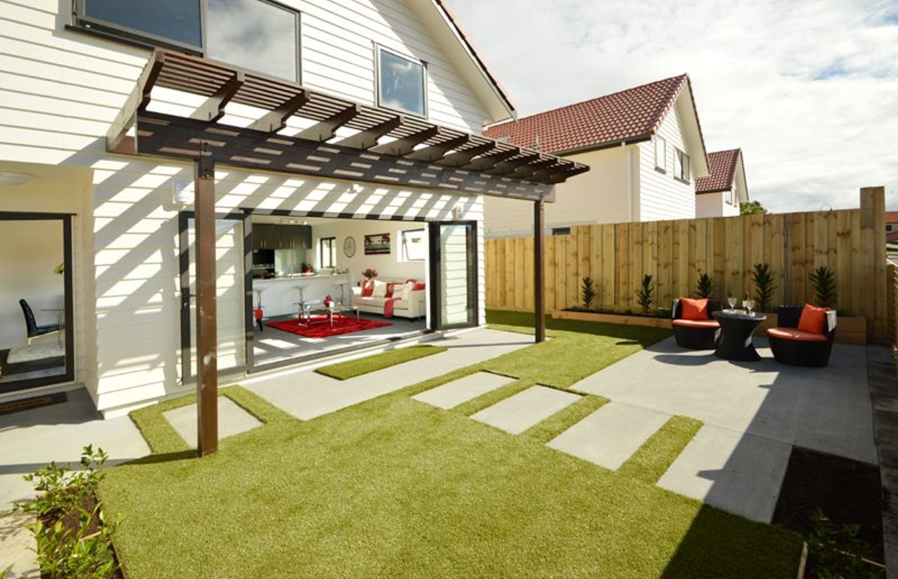 Front Entertaining Area - Beautifully designed north-facing, front entertaining area. The concrete steps cleverly guide you into the living area.