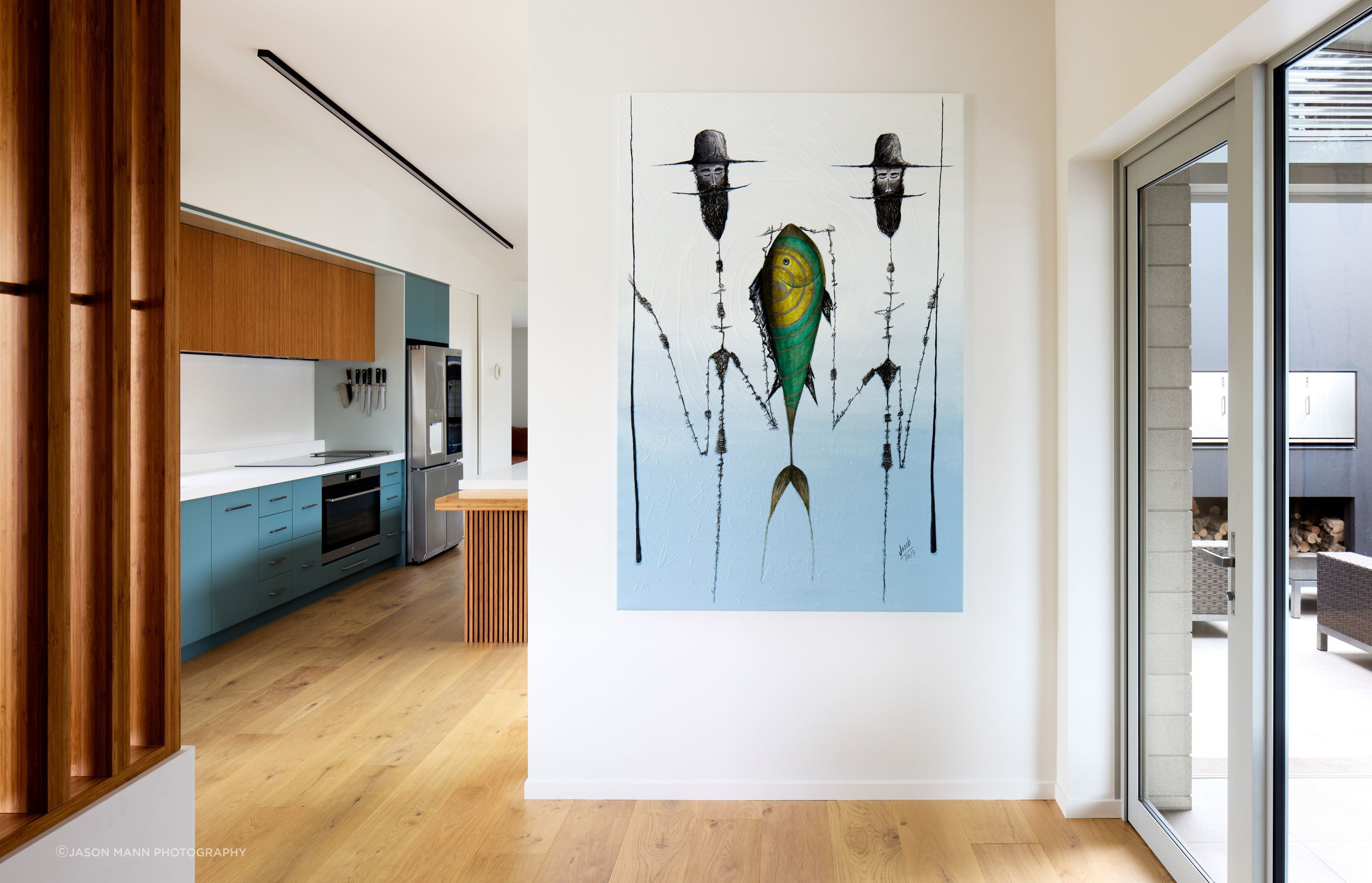 The homeowners are art collectors. “The painting on the wall at the front entrance was picked up from a street artist in Mexico. It’s a favourite piece and an important part of the house,” says Nick.