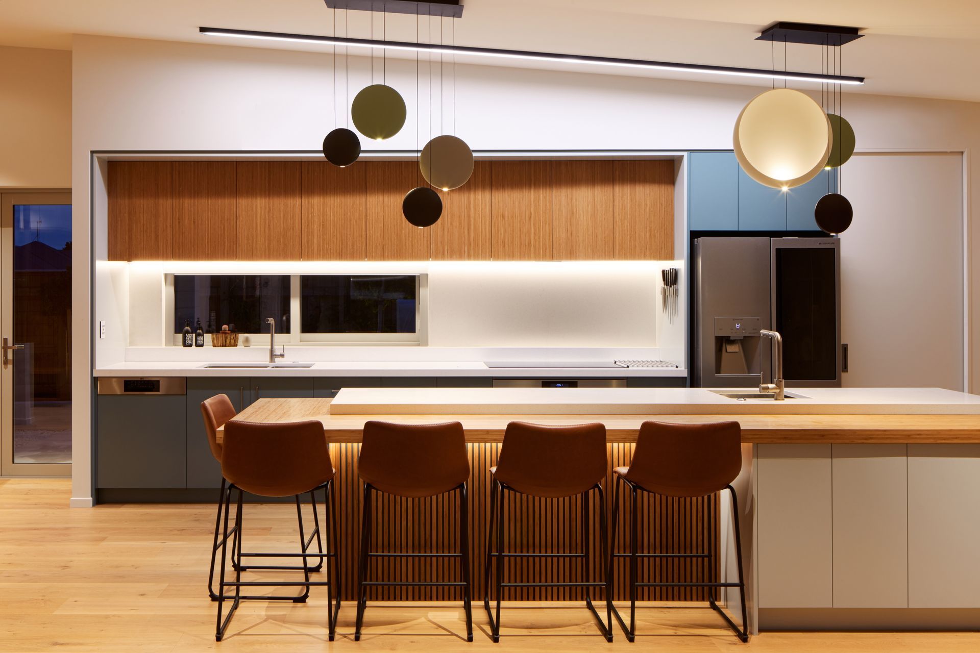 The Cosmos three-light chandelier is by Vibia. Thoughtful lighting is so important, says Nick. “A lot of the lighting is around creating scenes for how you might use a space. The rest of the world uses lighting quite differently to how we do it in New Zealand. It’s one of those things we think we can do ourselves but we're very quick to go with downlights.”