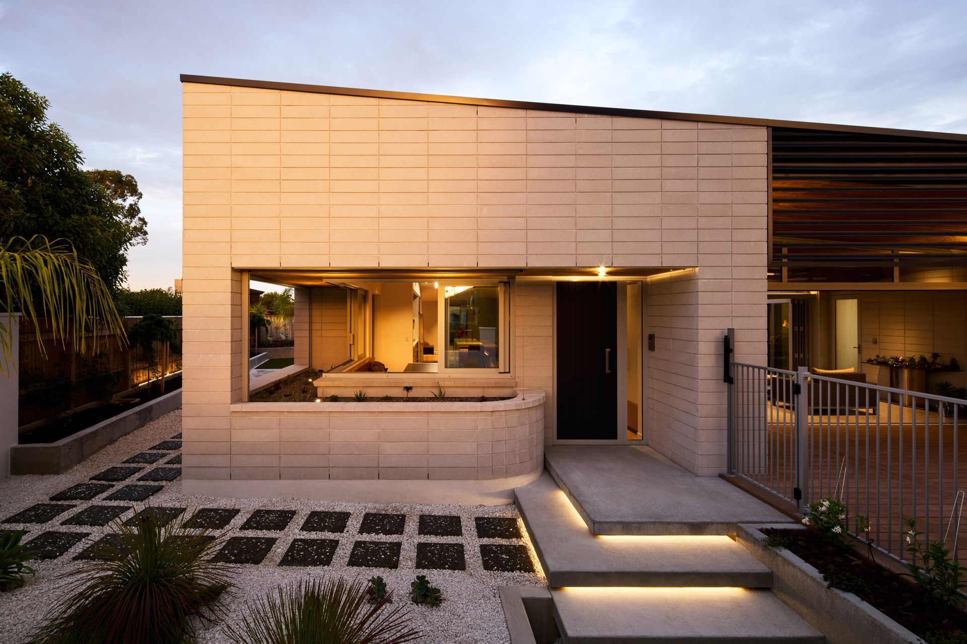 The homeowners, originally from Spain and the UK, came to New Zealand about 15 years ago. Now empty-nesters, their Palmerston North home designed by Nick Officer of First Light Studio in Wellington is perfectly suited to their lifestyle. The low-maintenance private facade belies a layout that can easily accommodate two, or a crowd.