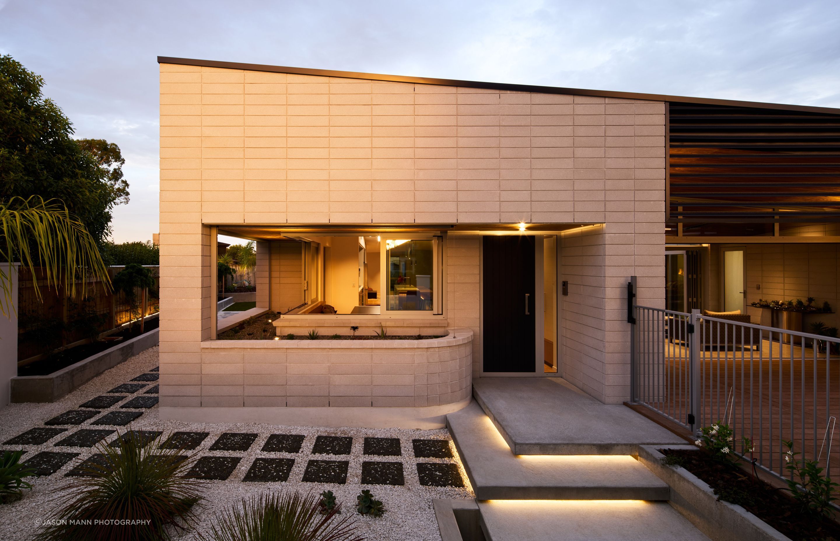 The homeowners, originally from Spain and the UK, came to New Zealand about 15 years ago. Now empty-nesters, their Palmerston North home designed by Nick Officer of First Light Studio in Wellington is perfectly suited to their lifestyle. The low-maintenance private facade belies a layout that can easily accommodate two, or a crowd.