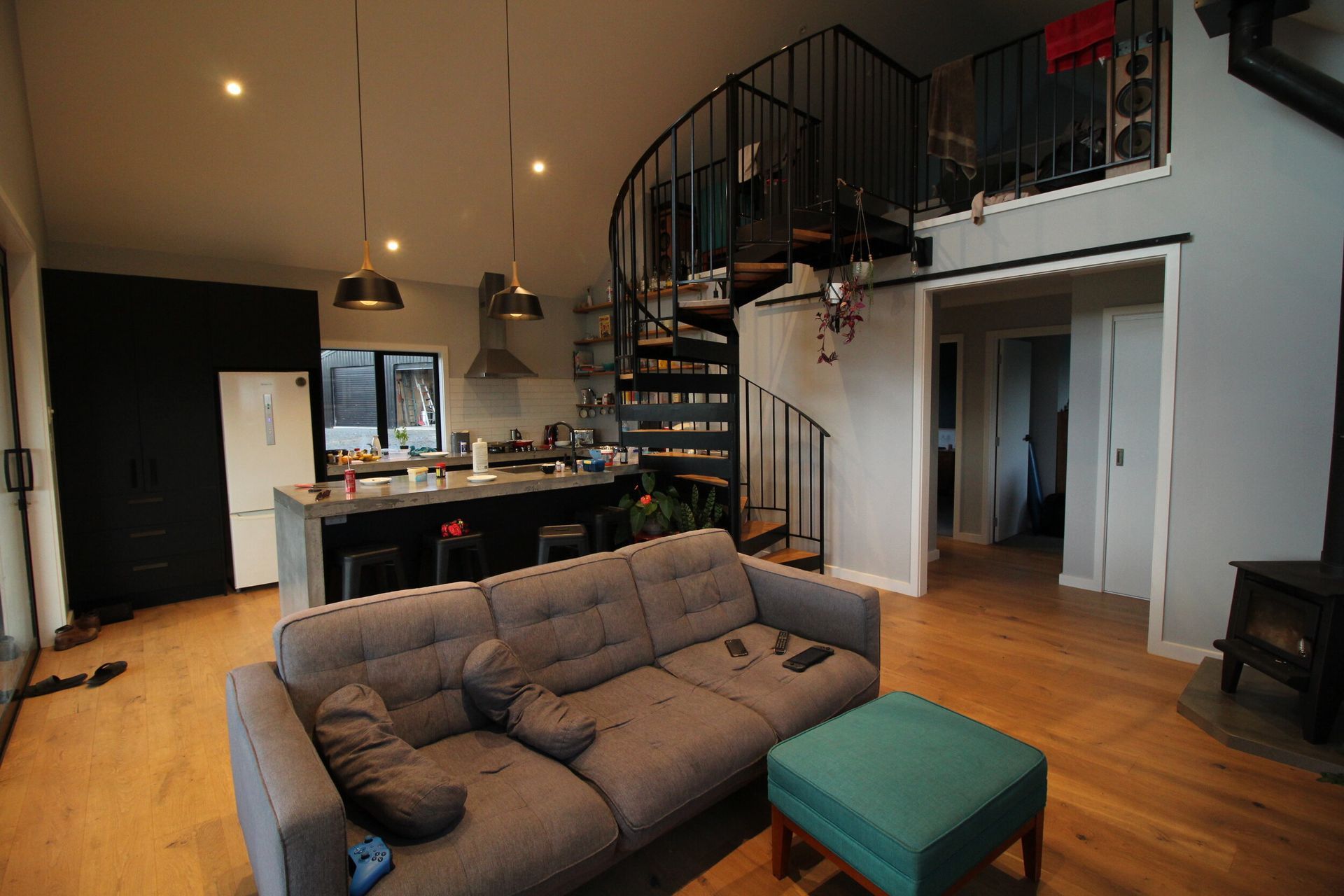 Shot from the living looking back over the kitchen and staircase.