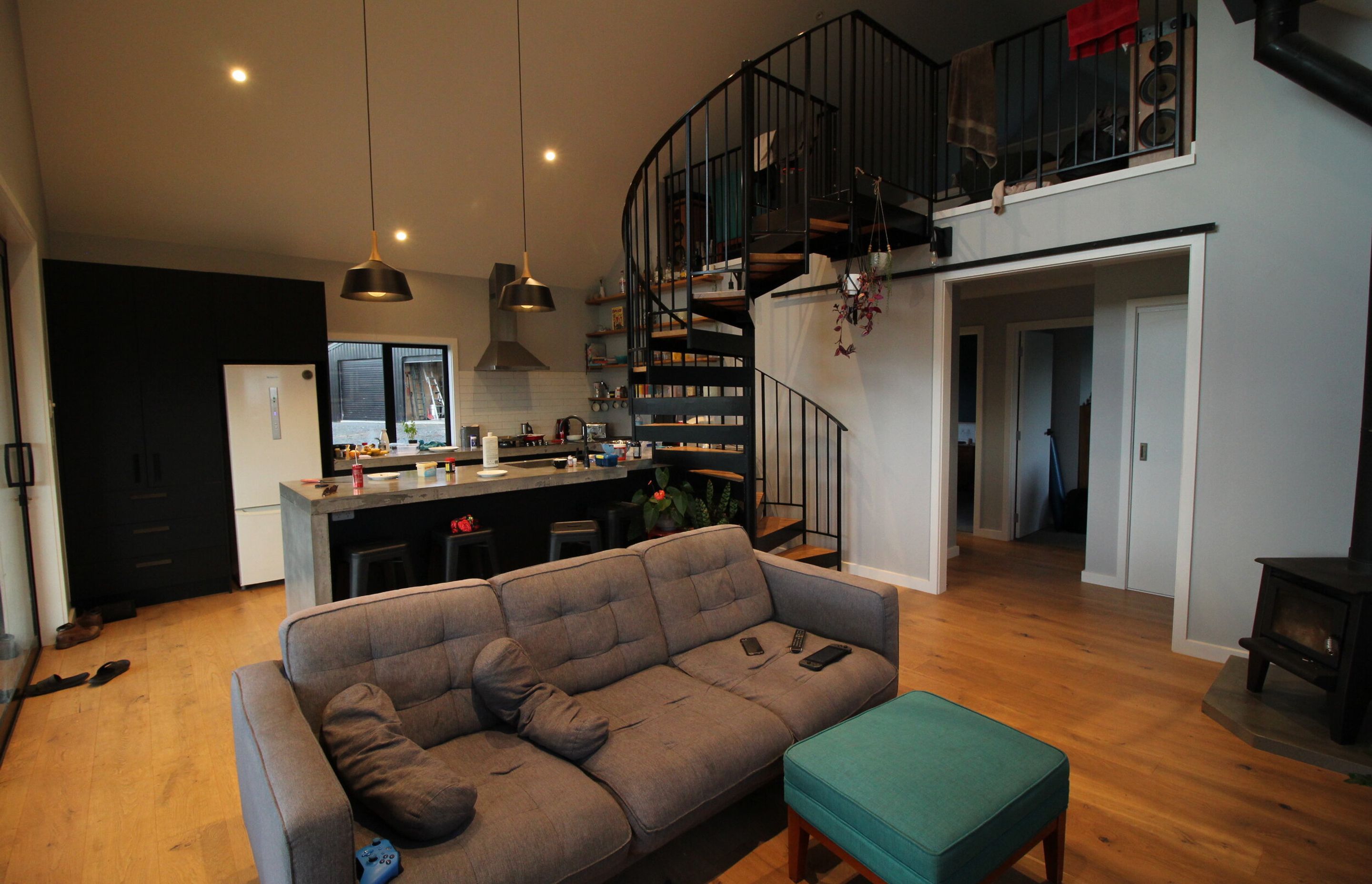 Shot from the living looking back over the kitchen and staircase.