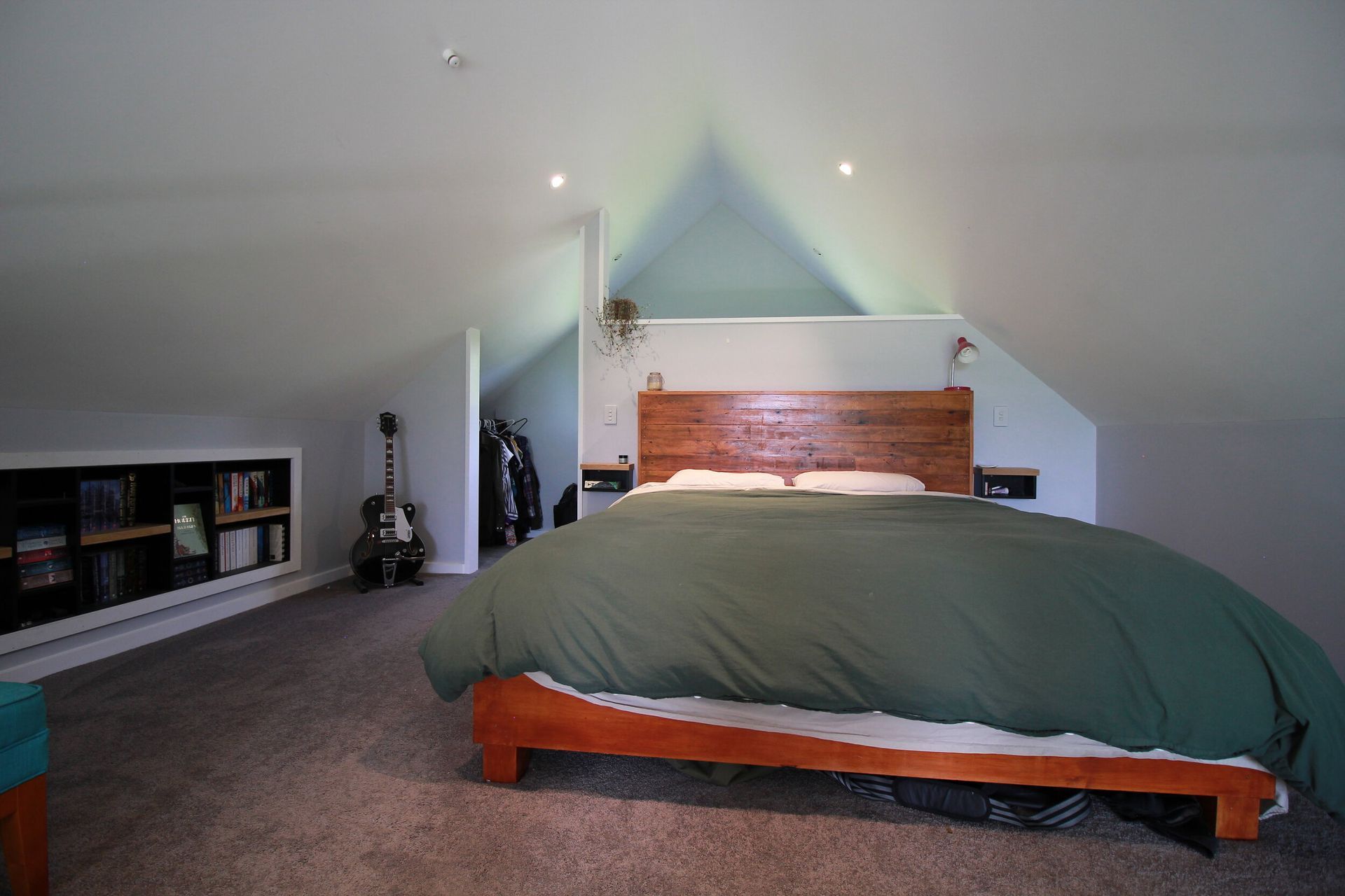 Currently being used as a master bedroom with a healthy sized walk in wardrobe around the back of the false wall.